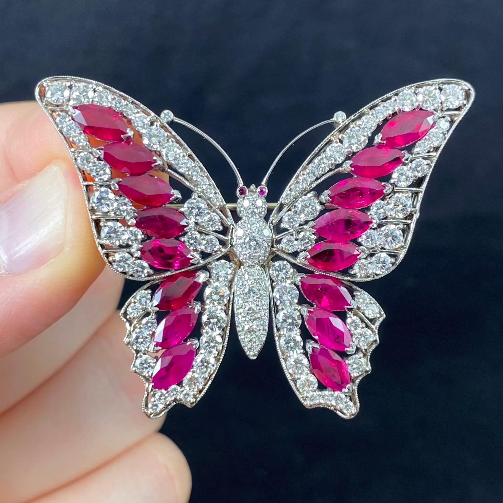 Vintage Ruby and Diamond Butterfly Brooch in Platinum and White Gold, 1990s. This brooch is modelled as a butterfly in flight, the winds decorated with marquise mixed-cut Burmese rubies and round brilliant-cut diamonds in an openwork design further