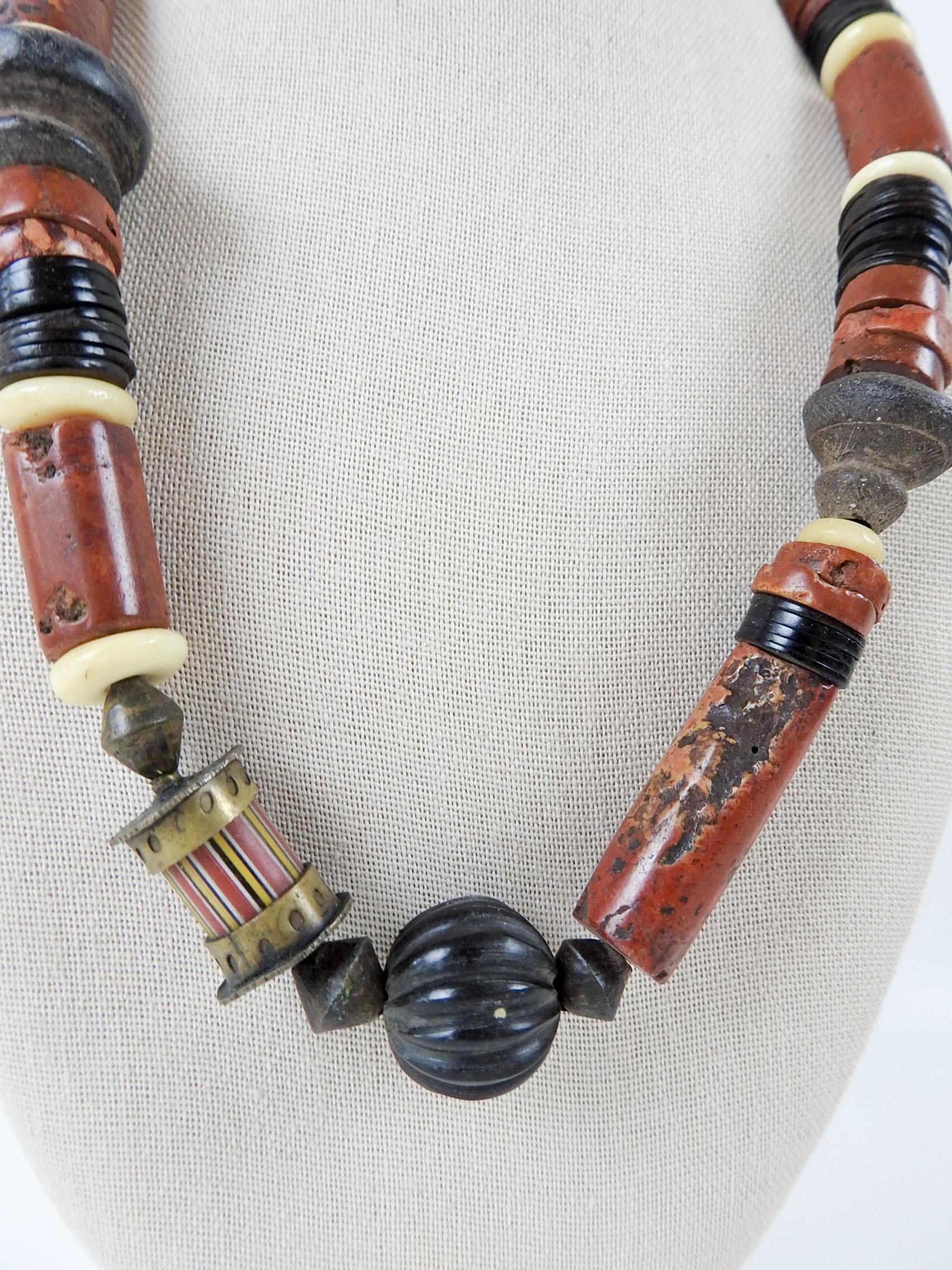 1990's Artist studio made beaded necklace using bauxite, cow horn, vintage pottery spindle whorls, glass trade beads, brass. By Linda Thompson (20th/21st century) Texas, 22