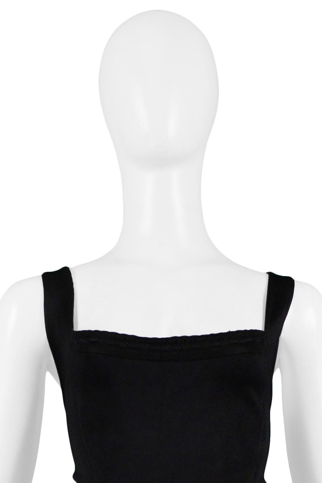 Resurrection Vintage is excited to offer a vintage Azzedine Alaia black racerback dress featuring a body-con fit, square neckline, wide straps, side seams, and center back clasp and center back zipper. 

Azzedine Alaia Paris
Size XS
Viscose