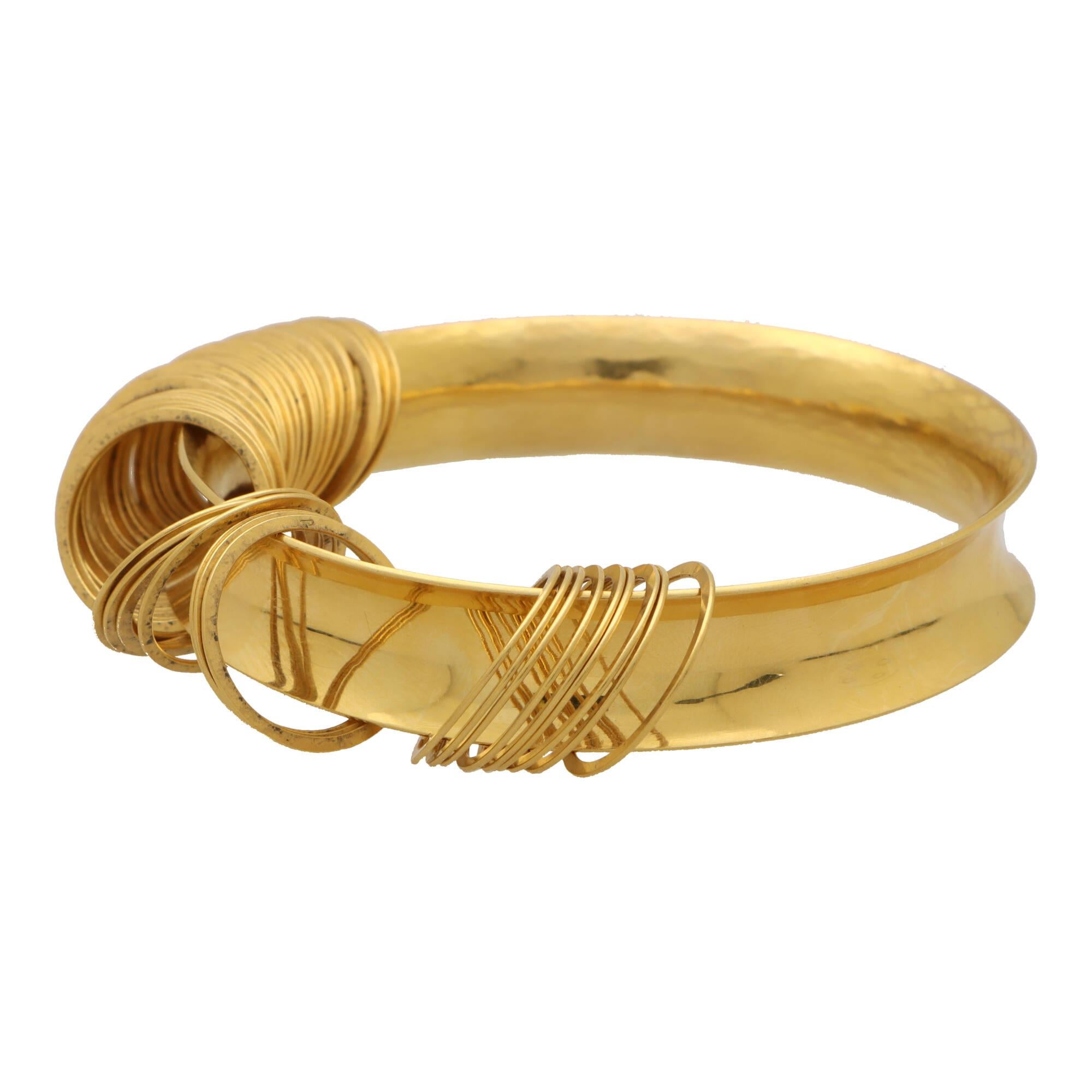 Vintage 1990's Bangle with Hanging Circle Motifs in 22k Yellow Gold In Excellent Condition For Sale In London, GB