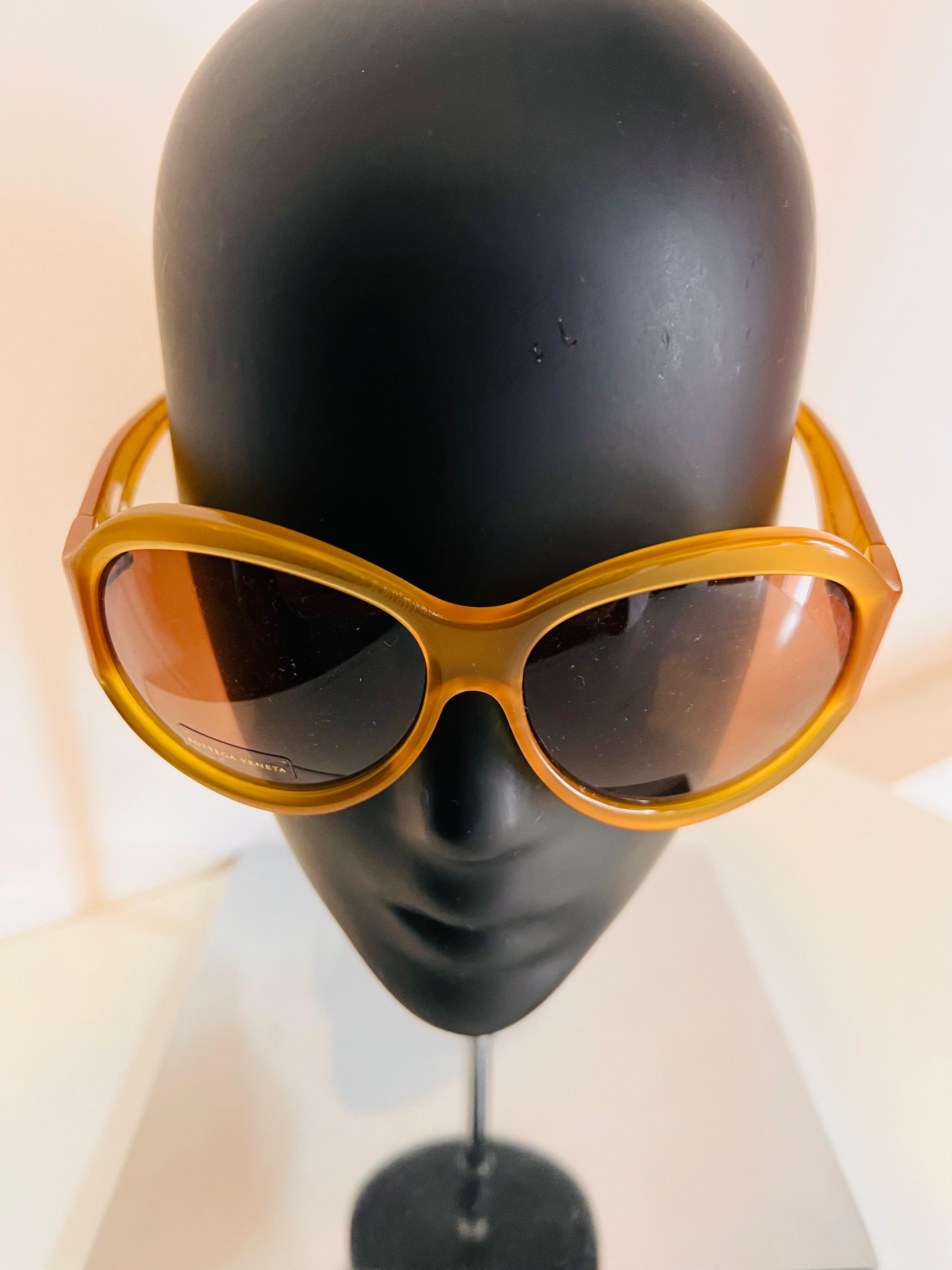 These beautifully honey coloured vintage 1990’s Bottega Veneta tilted oval sunglasses were sourced from an eyewear dealer in Rome, Italy and are a great example of this period of fashion for this now highly collectible Italian design house.

With