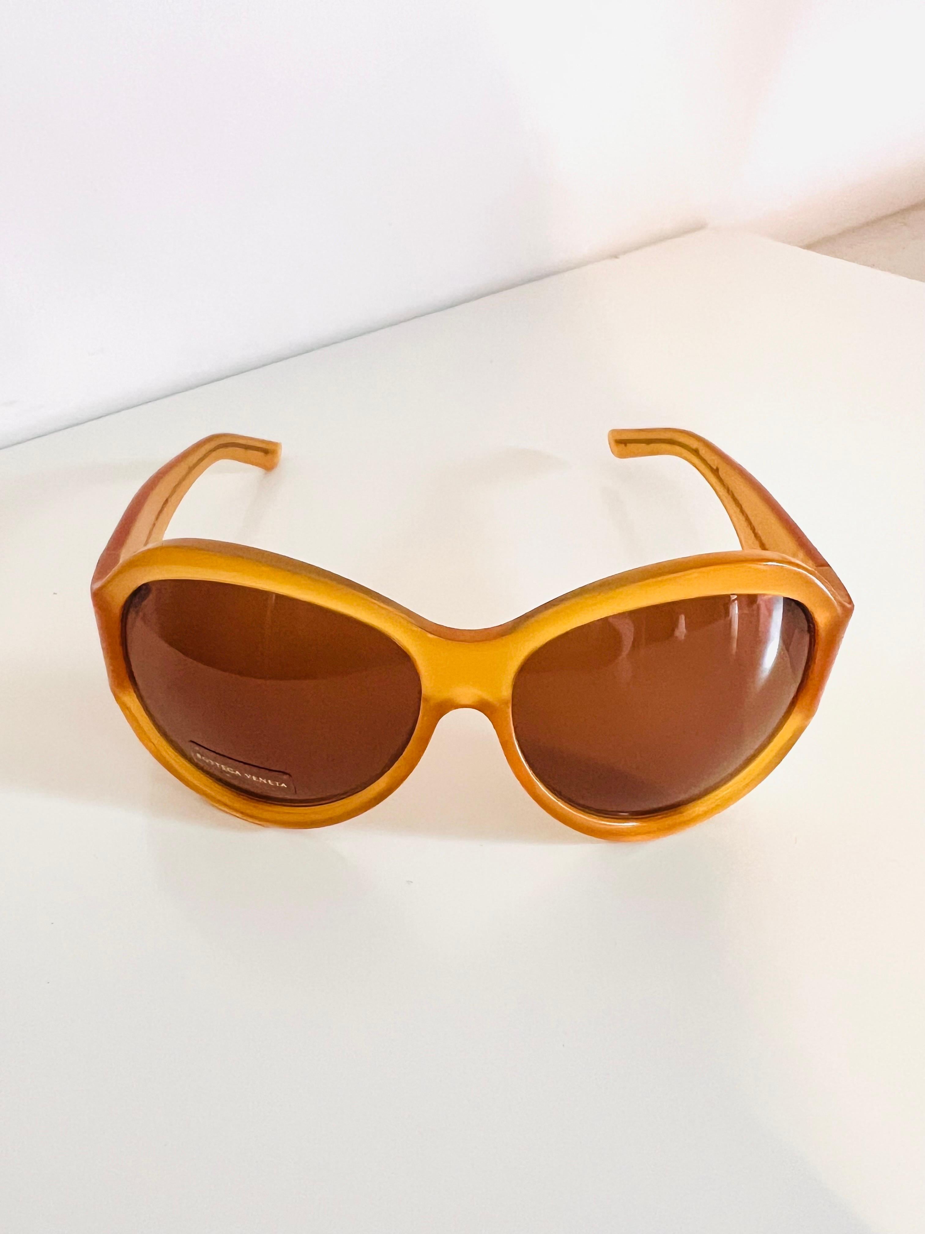 Vintage 1990s Bottega Veneta sunglasses in honey colour with butterfly detail 2