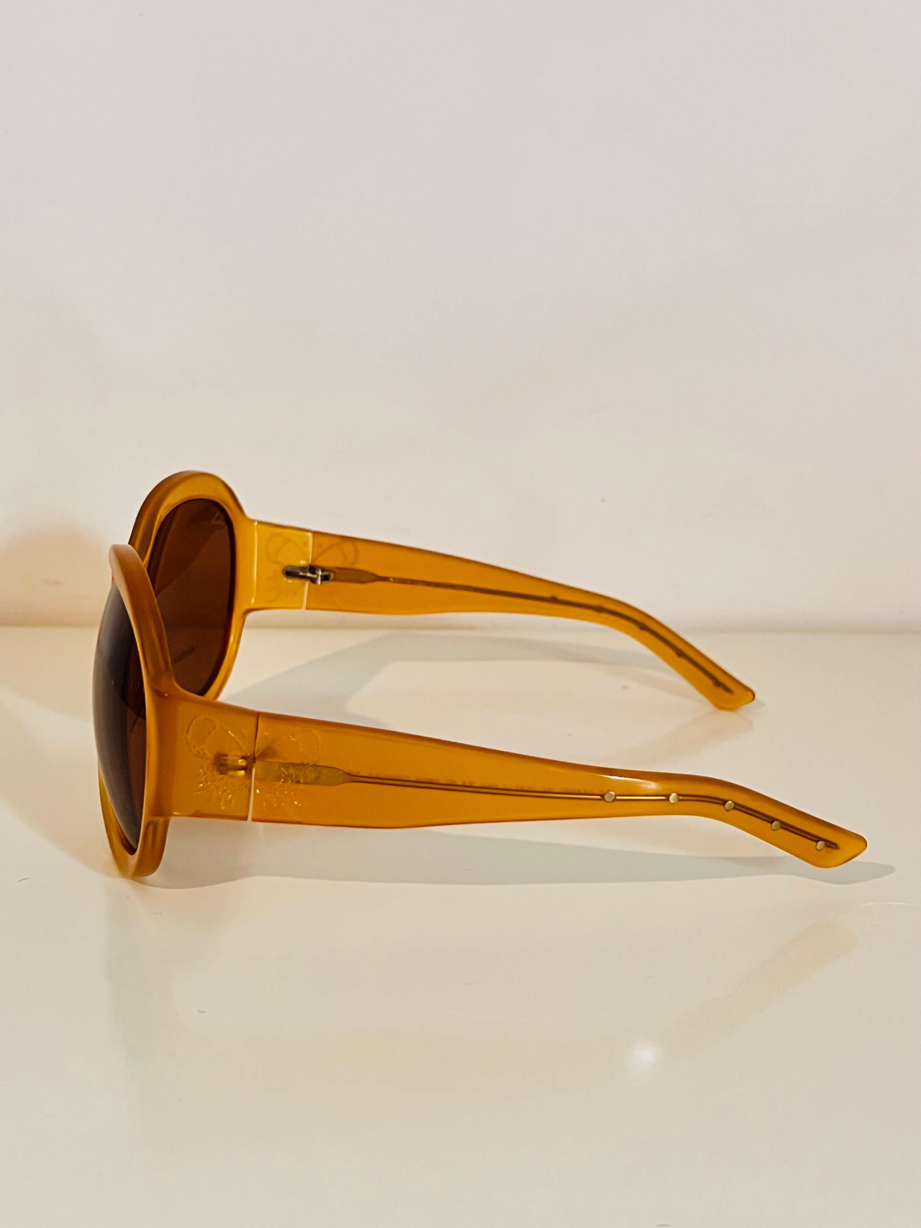 Vintage 1990s Bottega Veneta sunglasses in honey colour with butterfly detail 3
