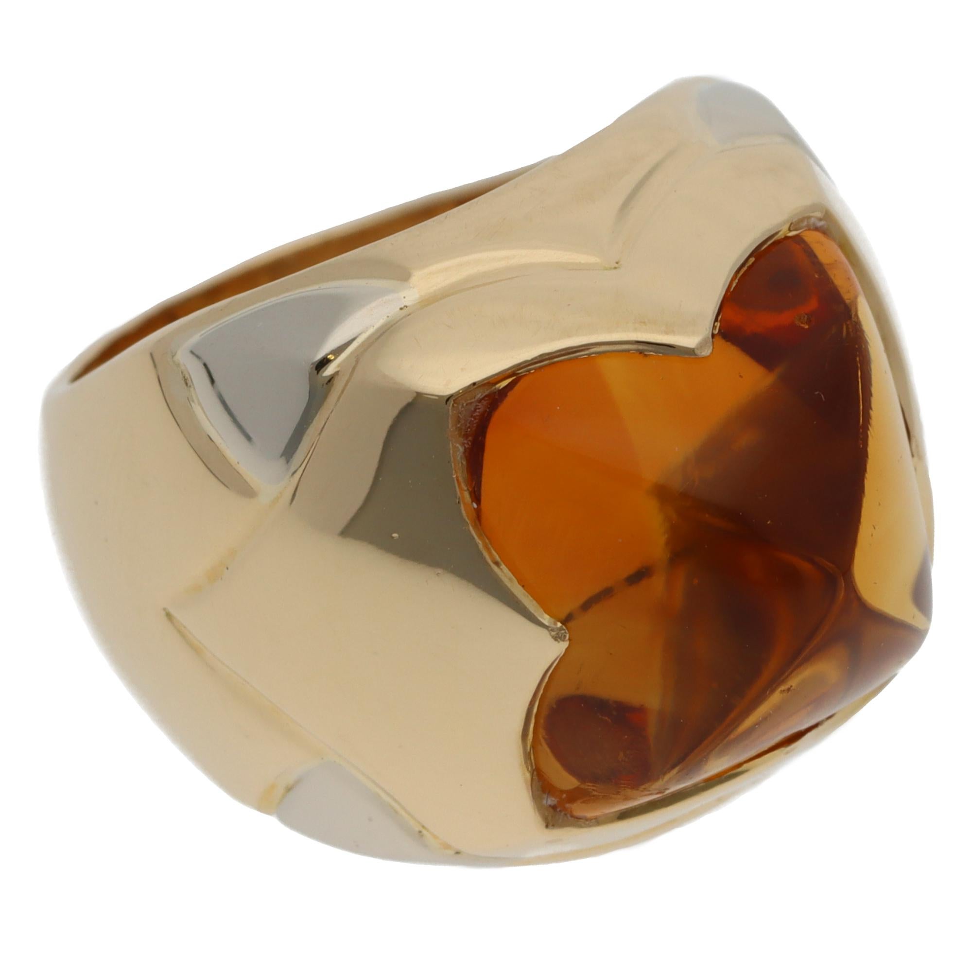 A beautiful vintage Bulgari Pyramid citrine ring set in 18k yellow and white gold, circa 1990s.

From the discontinued collection, the ring predominately features a large pyramid-shaped citrine. The citrine is bezel-set securely in polished yellow