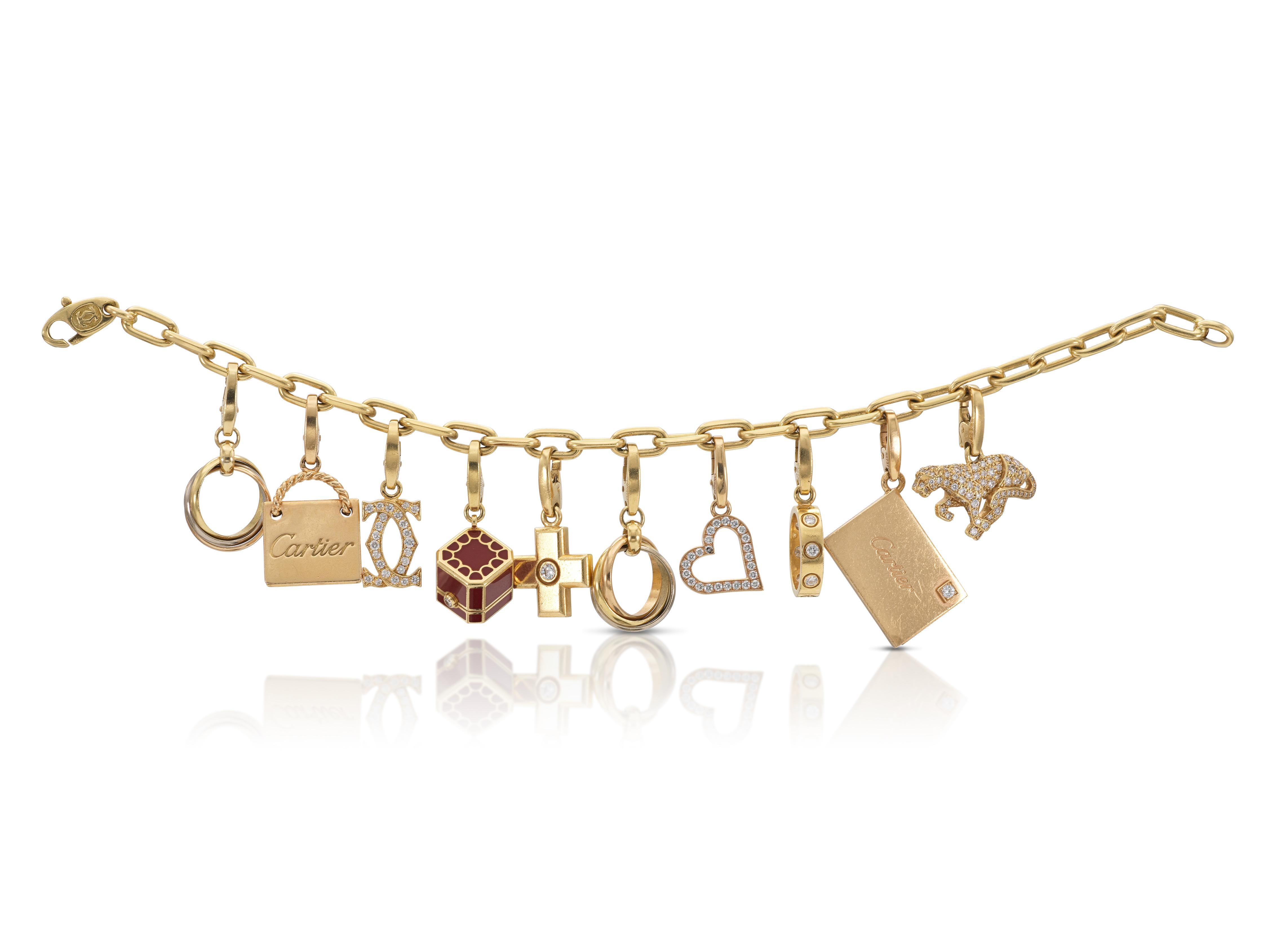 Finely crafted in 18k yellow gold with 10 iconic Cartier charms featuring Round Brilliant cut Diamonds and red enamel.
Signed by Cartier.
Circa 1990s
Size 7 inches