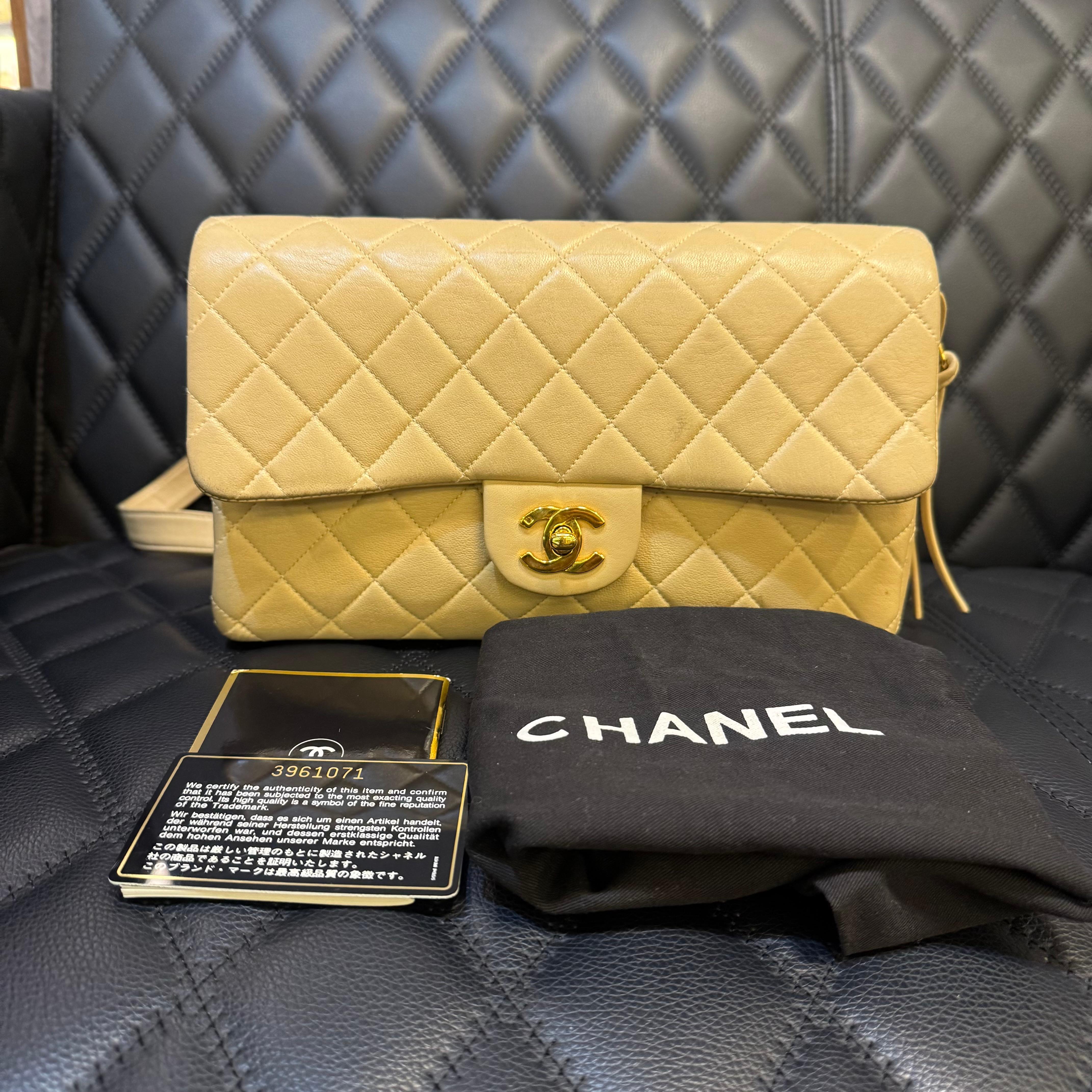 Chanel lambskin backpack in a classic medium flap shape with both zipper and flap closure. Slight scratch and rubbing throughout, especially on the corners due to wear and storage. Series 3. Comes with its holo intact, card, booklet and dust bag.