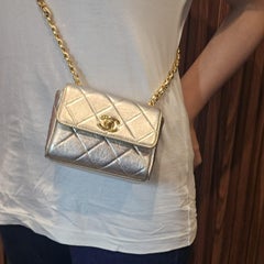 Vintage 1990s Chanel Extra Mini Silver Metallic Flap Bag.