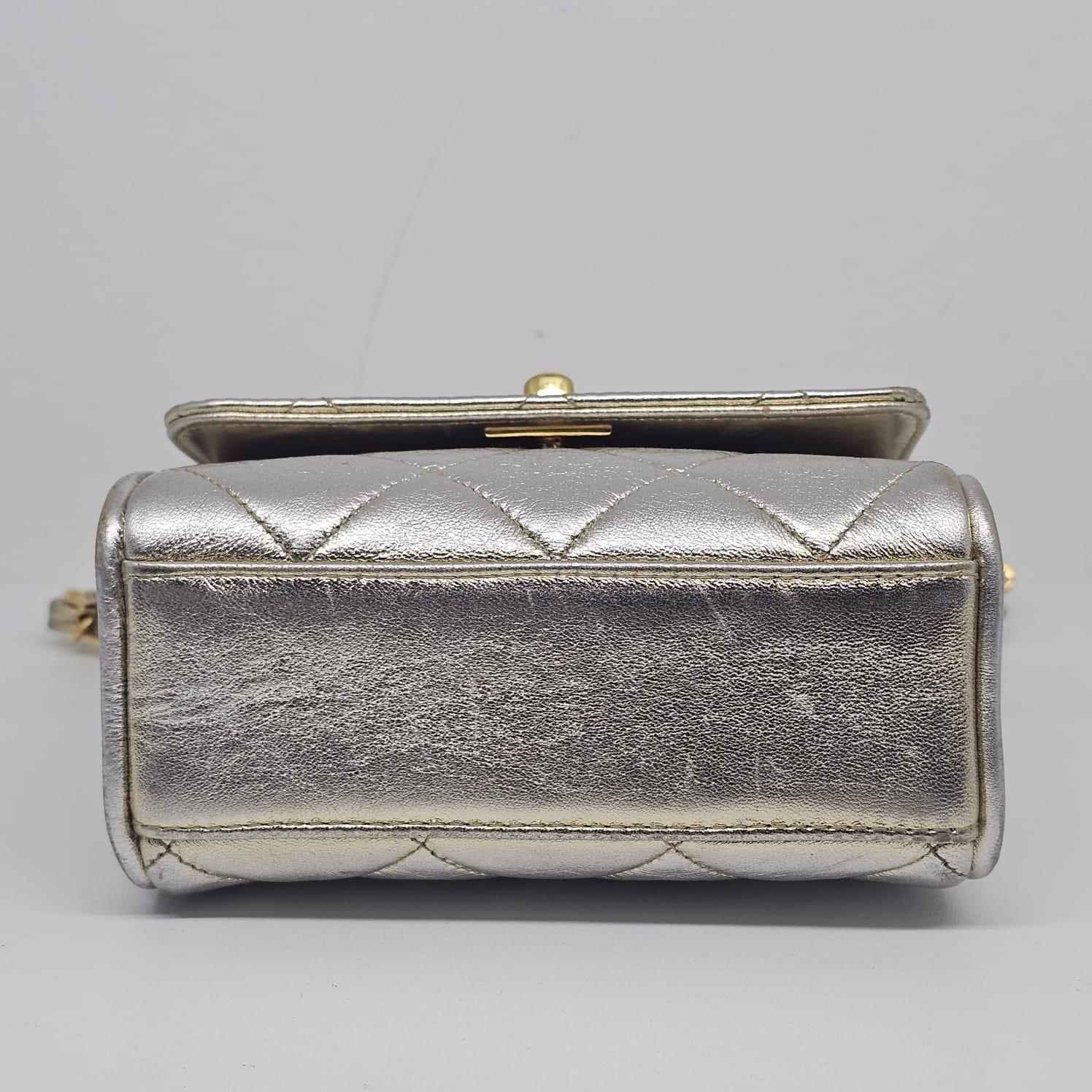 Women's or Men's Vintage 1990s Chanel Extra Mini Silver Metallic Flap Bag.