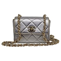 Vintage 1990s Chanel Extra Mini Silver Metallic Flap Bag.