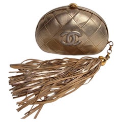 Vintage 1990s Chanel Gold Lambskin Quilted Round Tassle Clutch