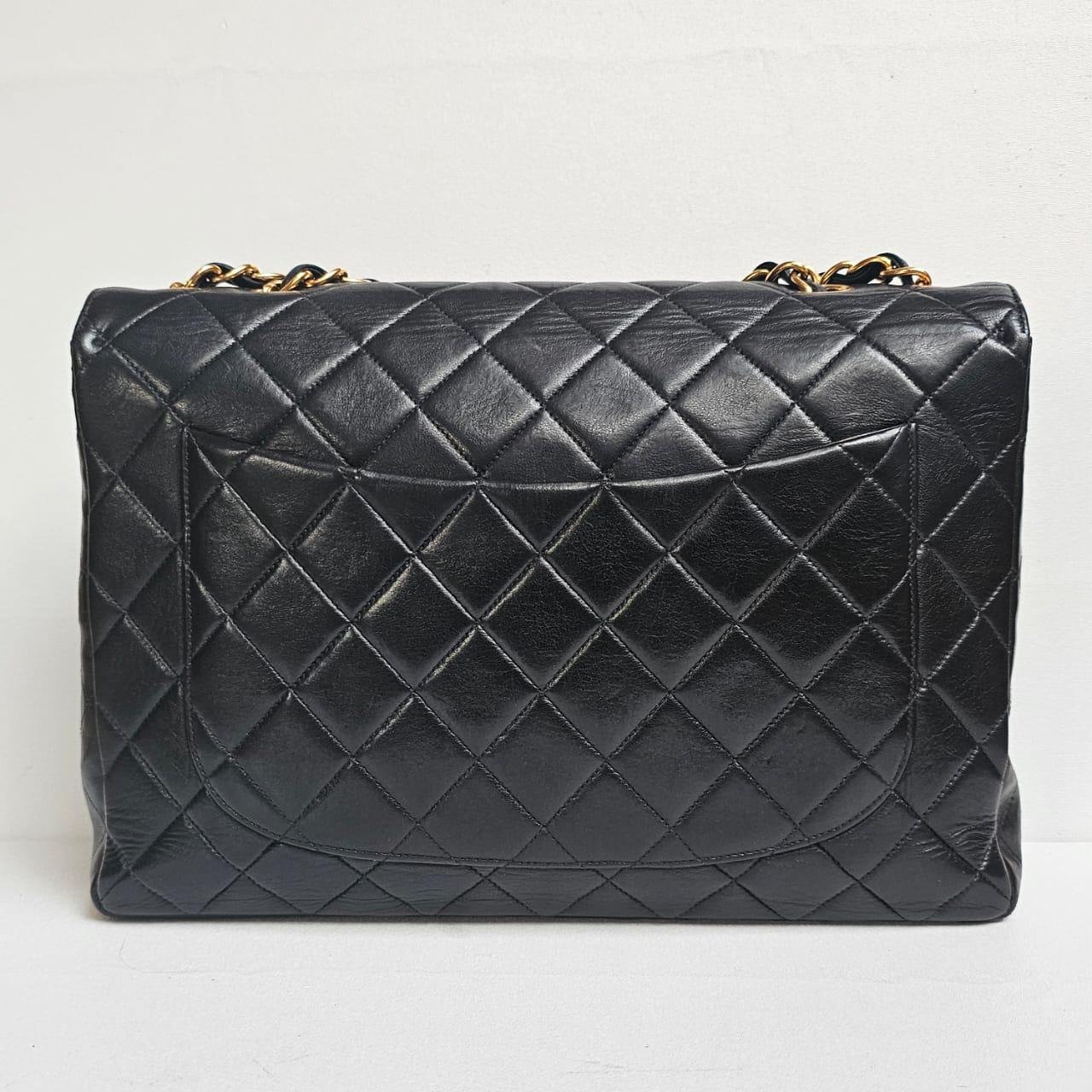 Classic Chanel Vintage Jumbo lambskin bag in black. Good vintage condition overall, with slight lost of structure and creases and scratches. Series #3. Comes with holo sticker and replacement chanel dust bag.