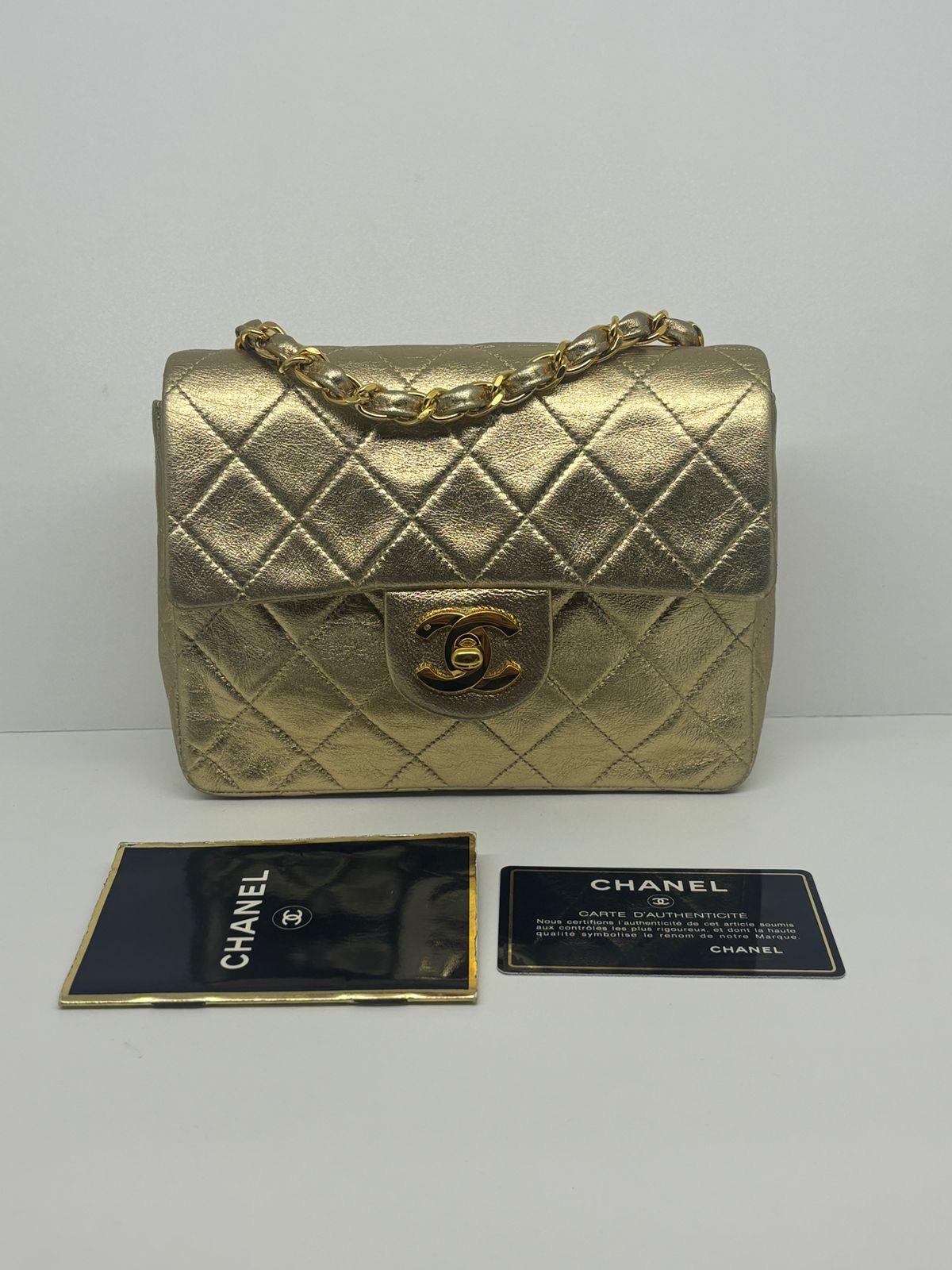 Rare vintage chanel mini square flap bag in gold lambskin leather. Beautiful vintage condition, only minor scratches and rubbing on the corners. Comes with its card and booklet. Hologram sticker has peeled off. Series #2.