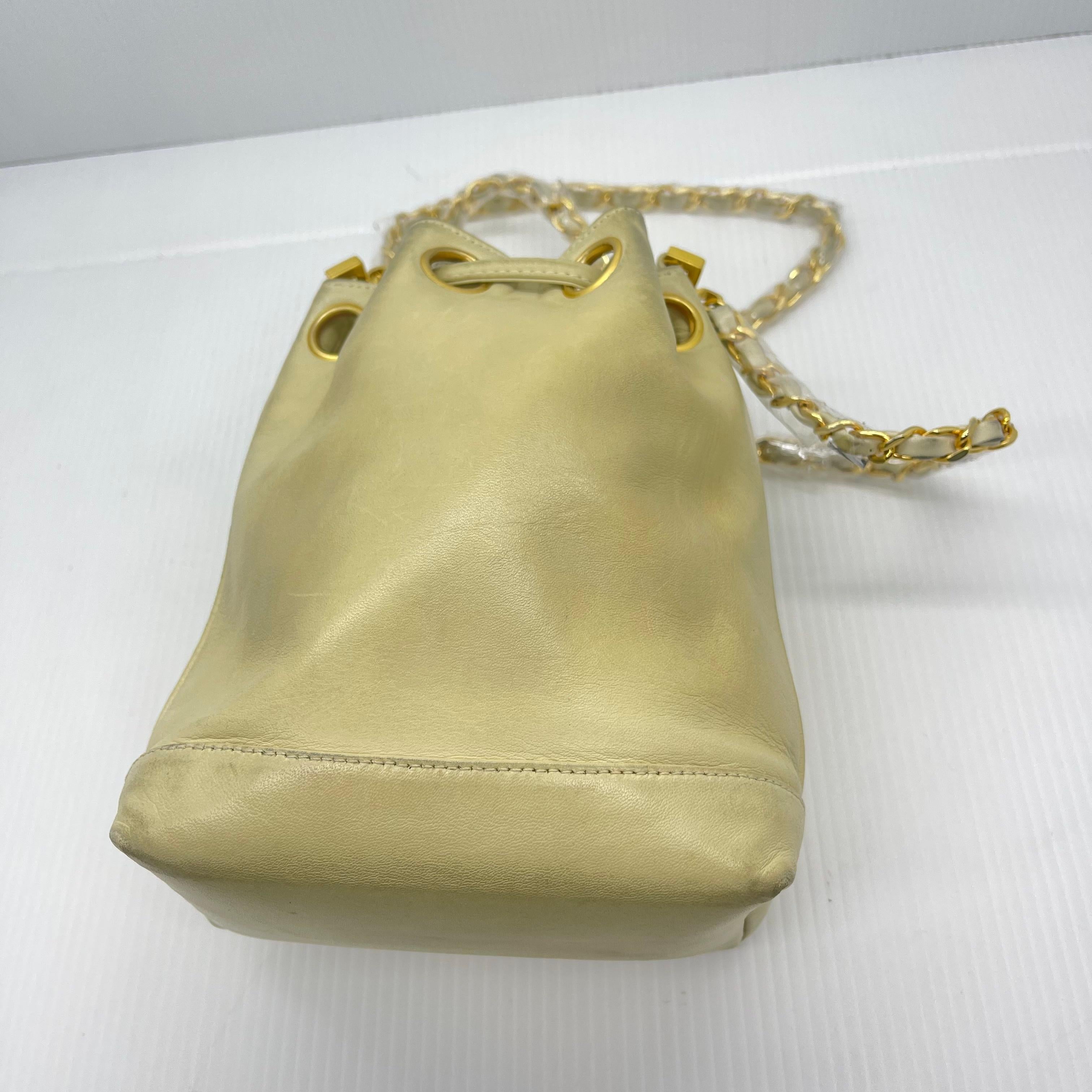 Vintage 1990s Chanel Mini Cream Lambskin CC Quilted Drawstring Bucket Bag For Sale 8