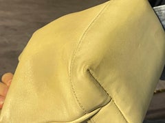 Vintage 1990s Chanel Mini Cream Lambskin CC Quilted Drawstring Bucket Bag