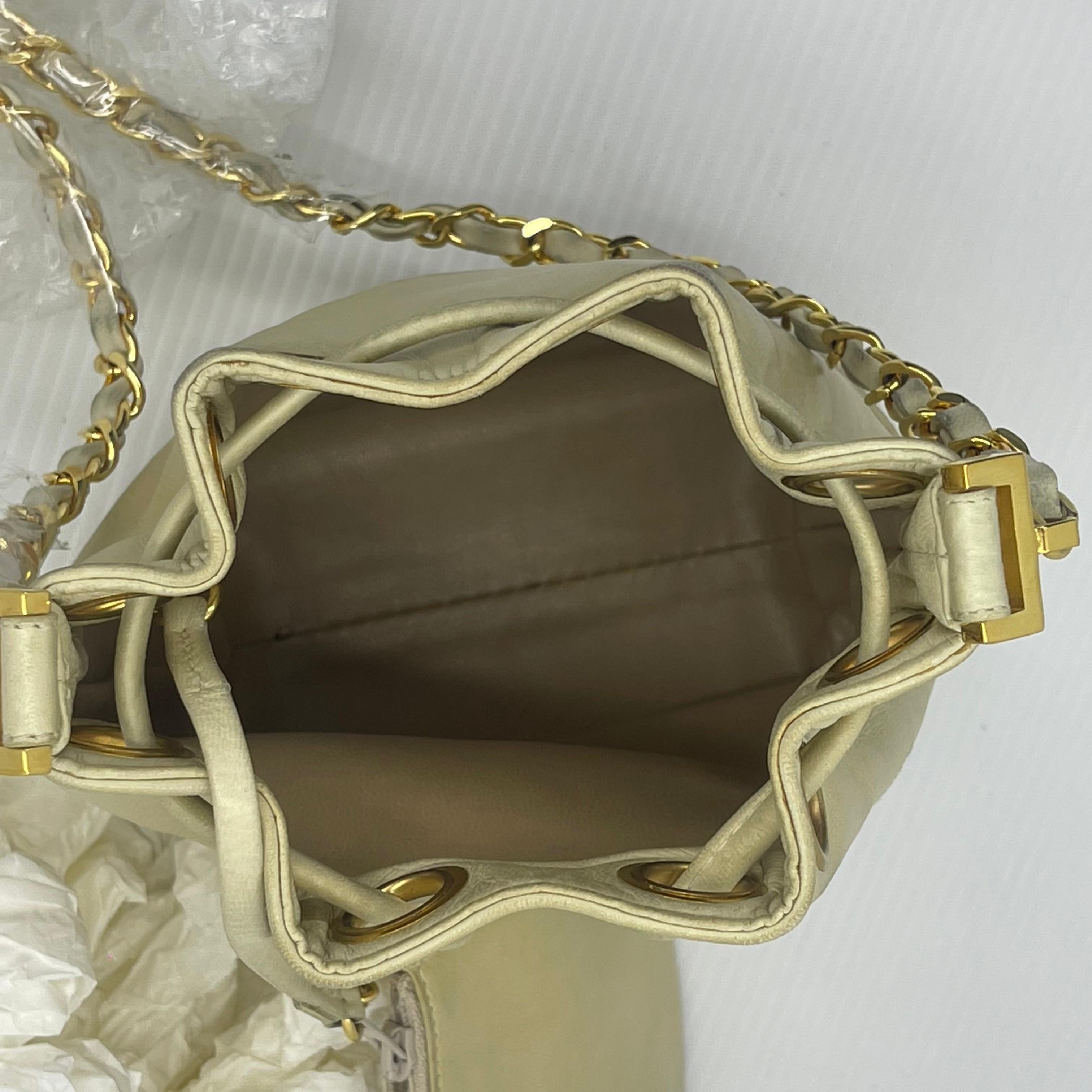 Vintage 1990s Chanel Mini Cream Lambskin CC Quilted Drawstring Bucket Bag For Sale 4