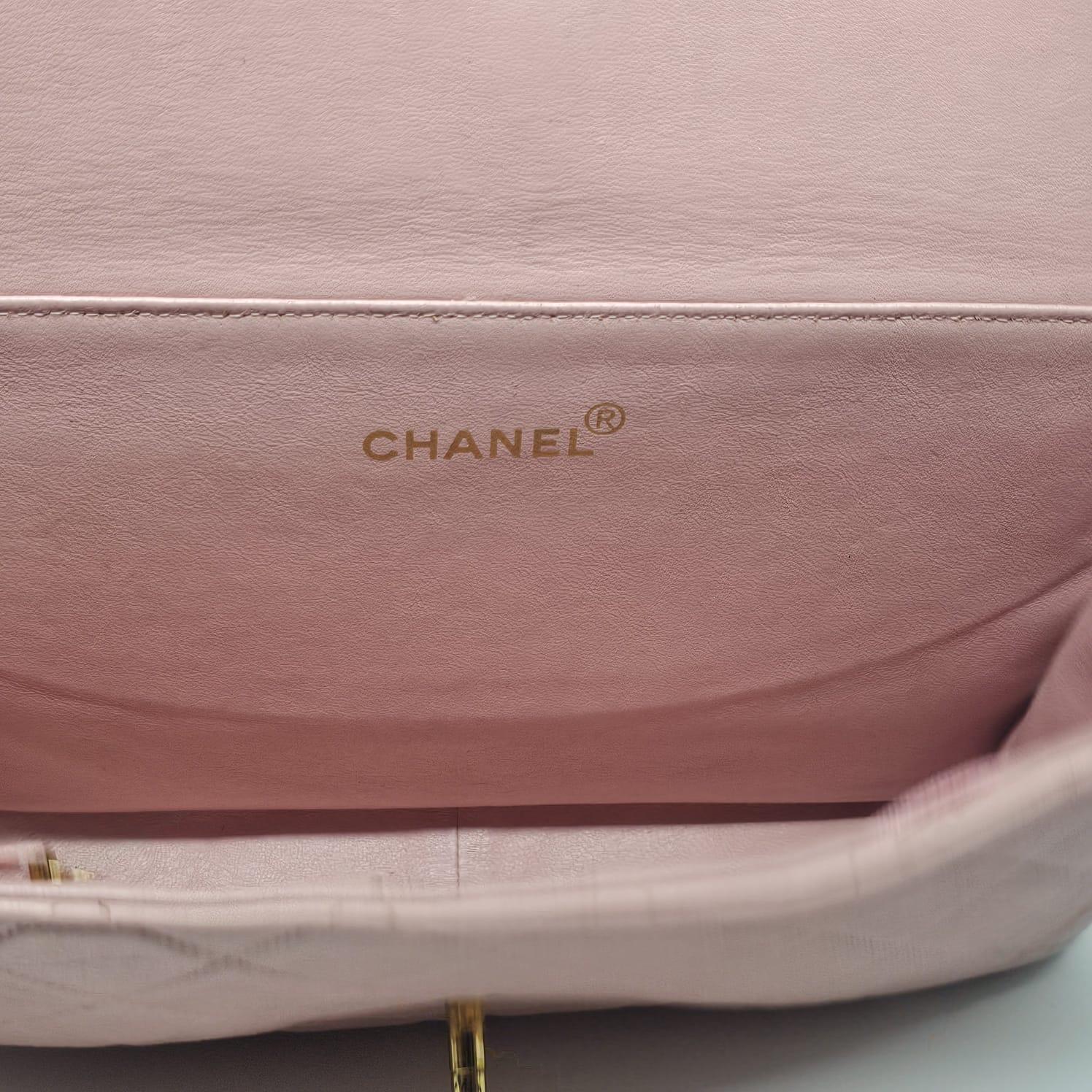 Chanel vintage biface lambskin bag in medium pink sakura. Very rare color. Original condition. Slight scuffing and scratches throughout. Dark rubbing on the corners. Light wrinkling on the leather. Holo slightly rubbed off but still readable. Series