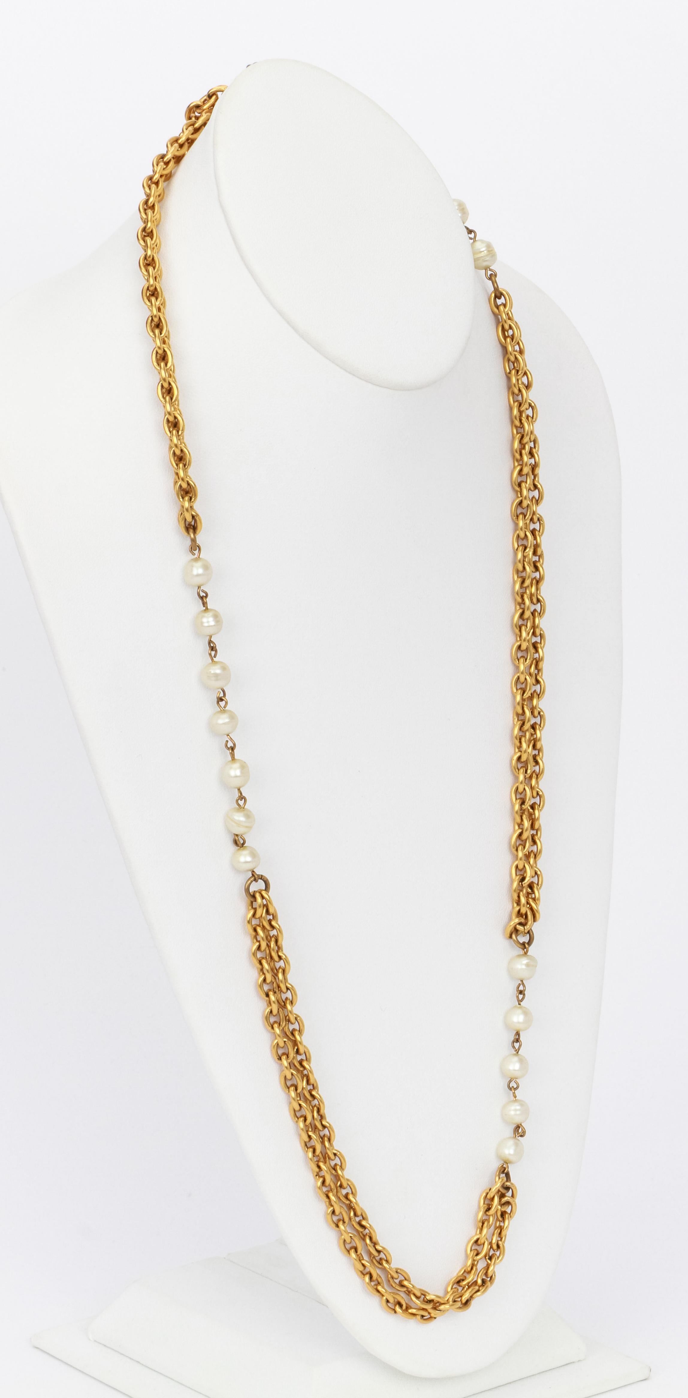 Chanel sautoir double gold chain necklace with pearls. Minor scuffing on pearls. Comes with velvet pouch .