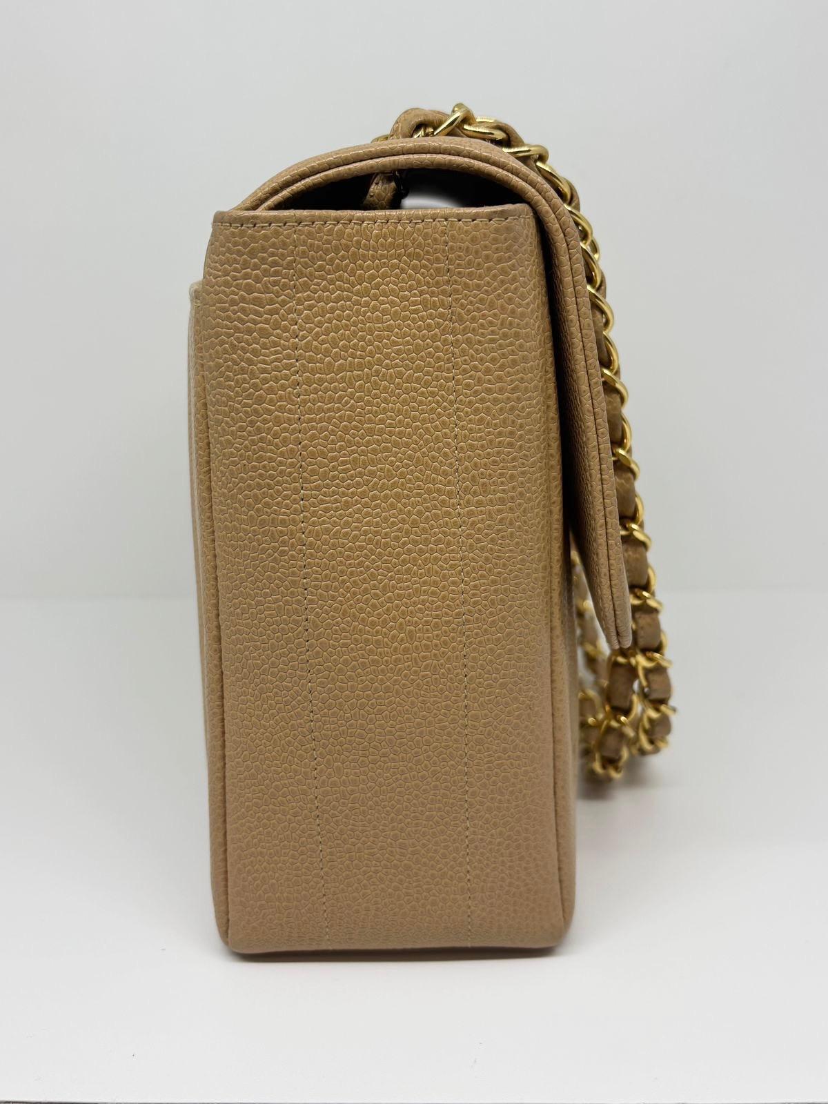 Vintage chanel vertical quilted caviar leather in caramel color with gold hardware. Beautiful honey brown color. Minor spot marks throughout the leather surface. Light scuffings on the body and corners of the bag. Series #3. Overall in good vintage