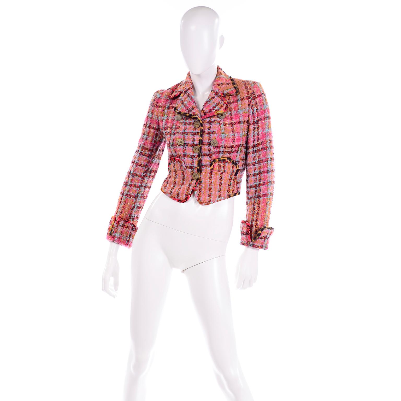 This is such a fun pink plaid blazer with the Bazar de Christian Lacroix label.This wonderful vintage jacket has a fun boucle windowpane weave, with mustard, baby blue, red, grey, and sparkling gold woven in with the pale pink and hot pink yard. It