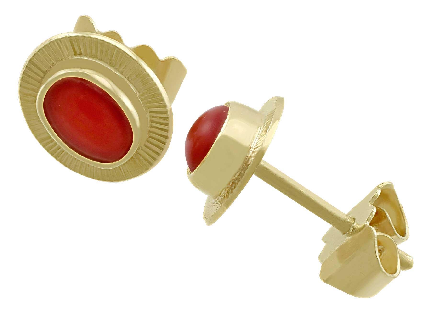 A fine and impressive pair of coral and 18 karat yellow gold stud earrings; part of our vintage jewelry and estate jewelry collections

This fine and impressive pair of vintage coral stud earrings has been crafted in 18k yellow gold.

Each earring