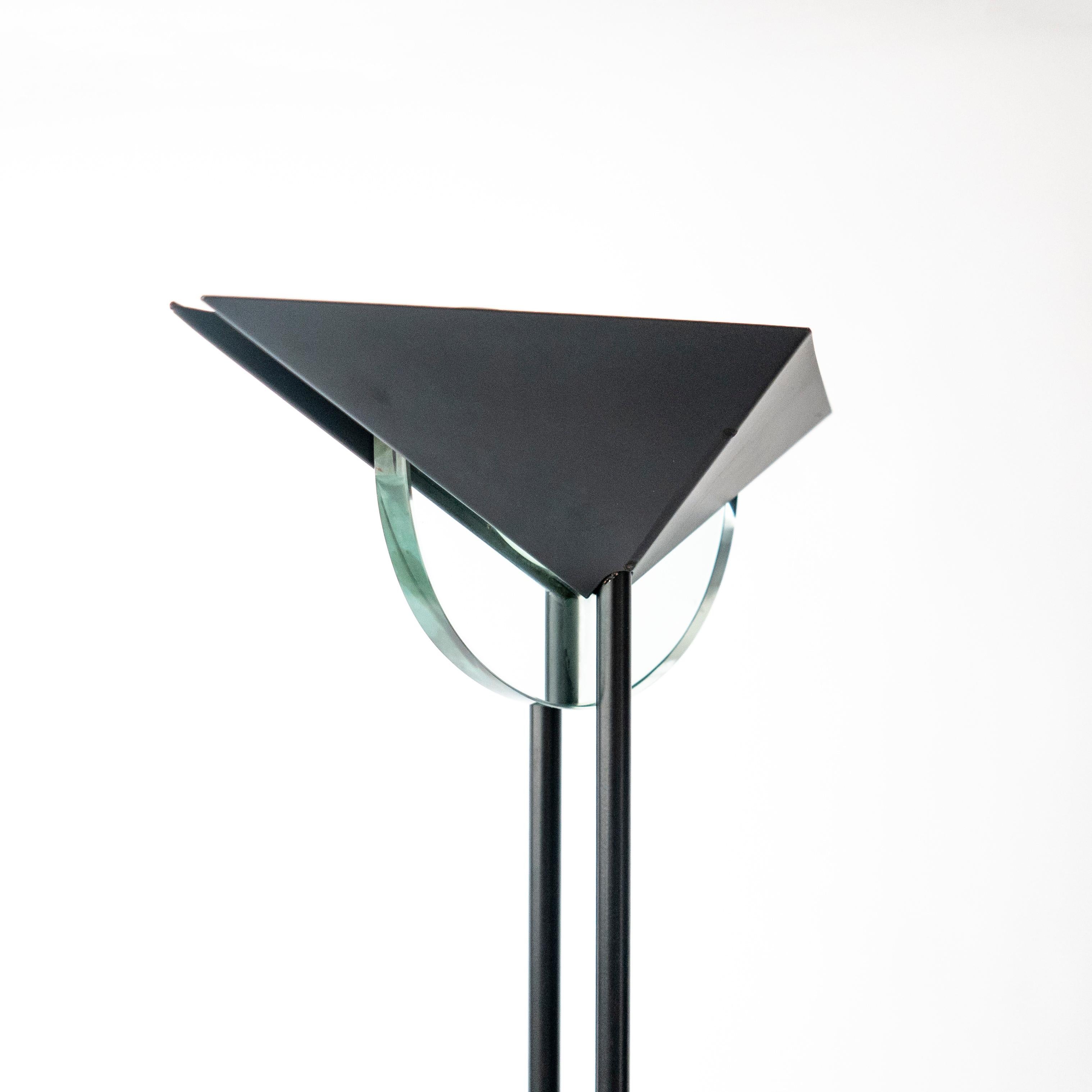 Vintage 1990s floor lamp in the style of Fontana Arte, with a metal structure painted in matte black and a rhomboidal lampshade concealing an alogen light bulb. Two decorative touches are added by a half-moon in aquamarine glass at the top, and a