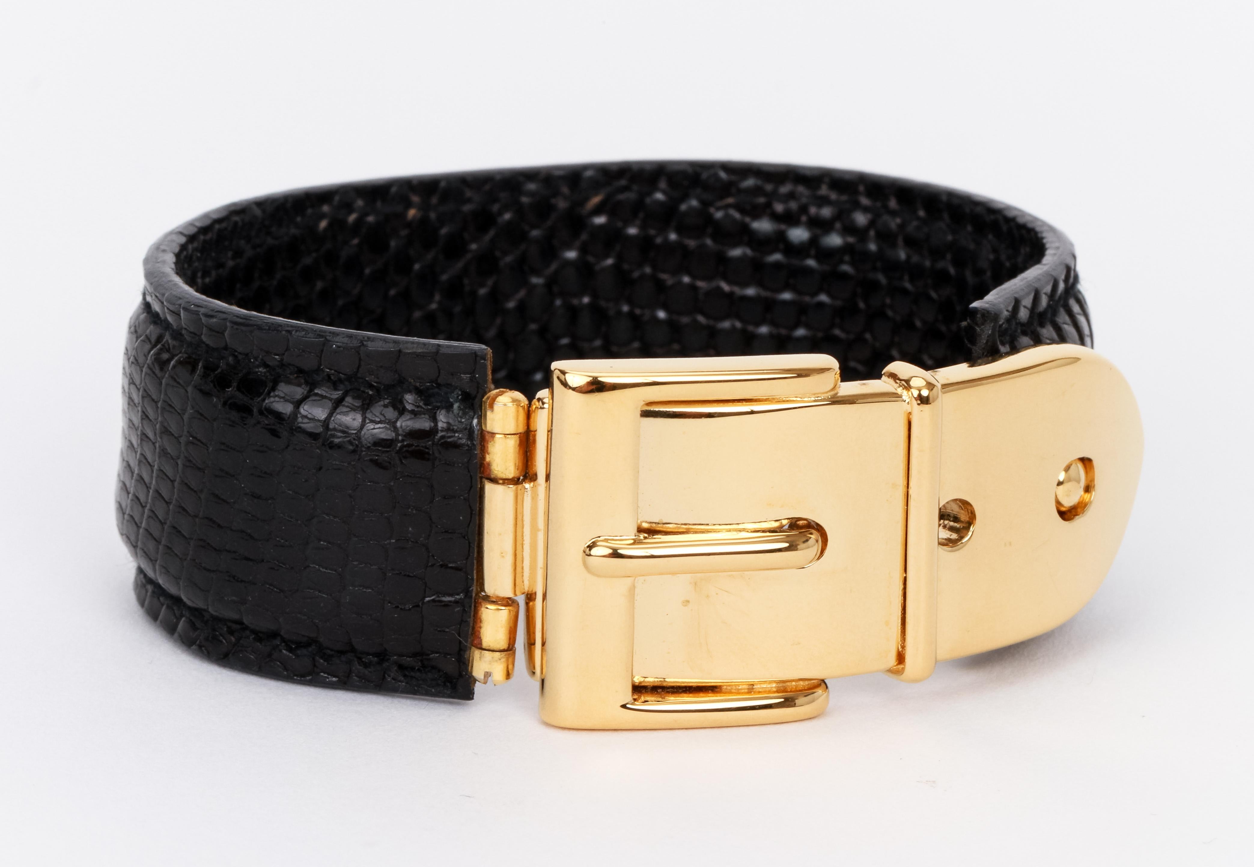 90's Vintage Gucci Black Lizard Leather Gold Buckle Bracelet. Fits small/medium wrist. Diameter 2. 4