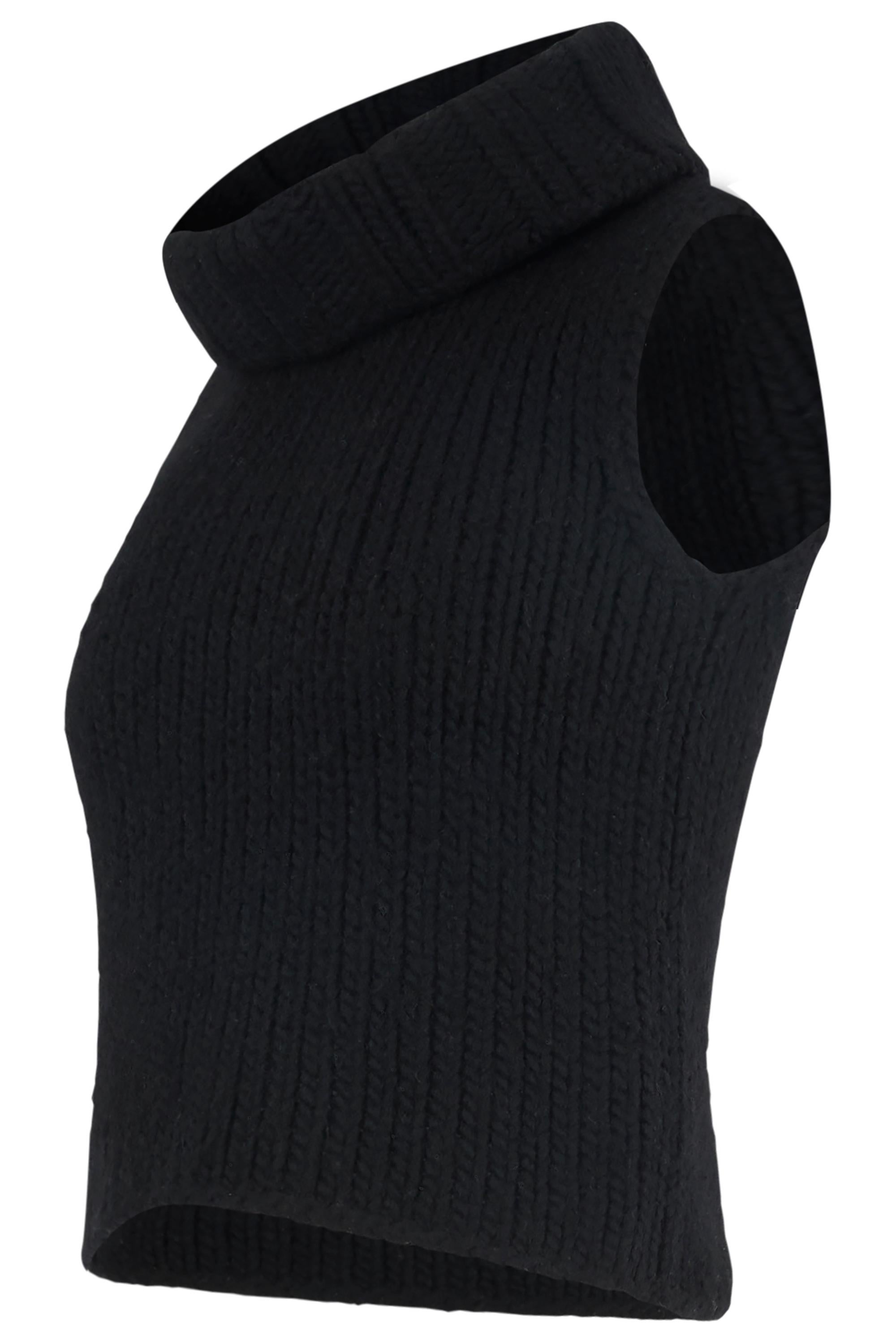 Top vintage anni '90 Gucci by Tom Ford in maglia di lana nera a collo alto. Fabrice in maglia nera, senza maniche e con collo alto.

In eccellenti condizioni vintage. 

Marchio: Gucci
Colore: nero
Taglia: UK 6-8
Taglia moderna: UK 6-8, US: 4, EU: