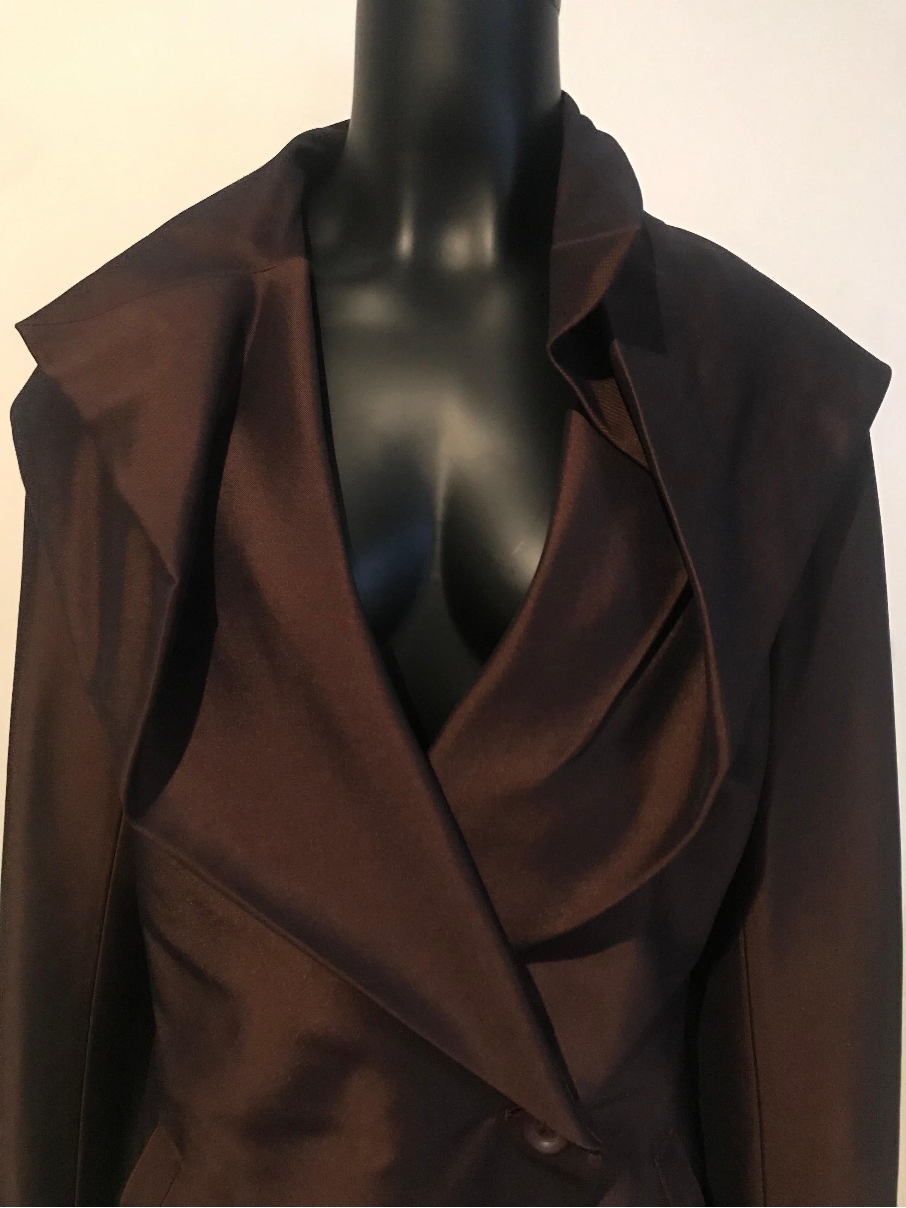 Architecturally cut and crafted archive Issey Miyake evening jacket from the late 1990’s in unique bronze/brown shimmering fabric. 

Made in Japan

Amazing cut to this unique piece for anyone’s wardrobe. 

Collectible 

Says size XL but would fit a