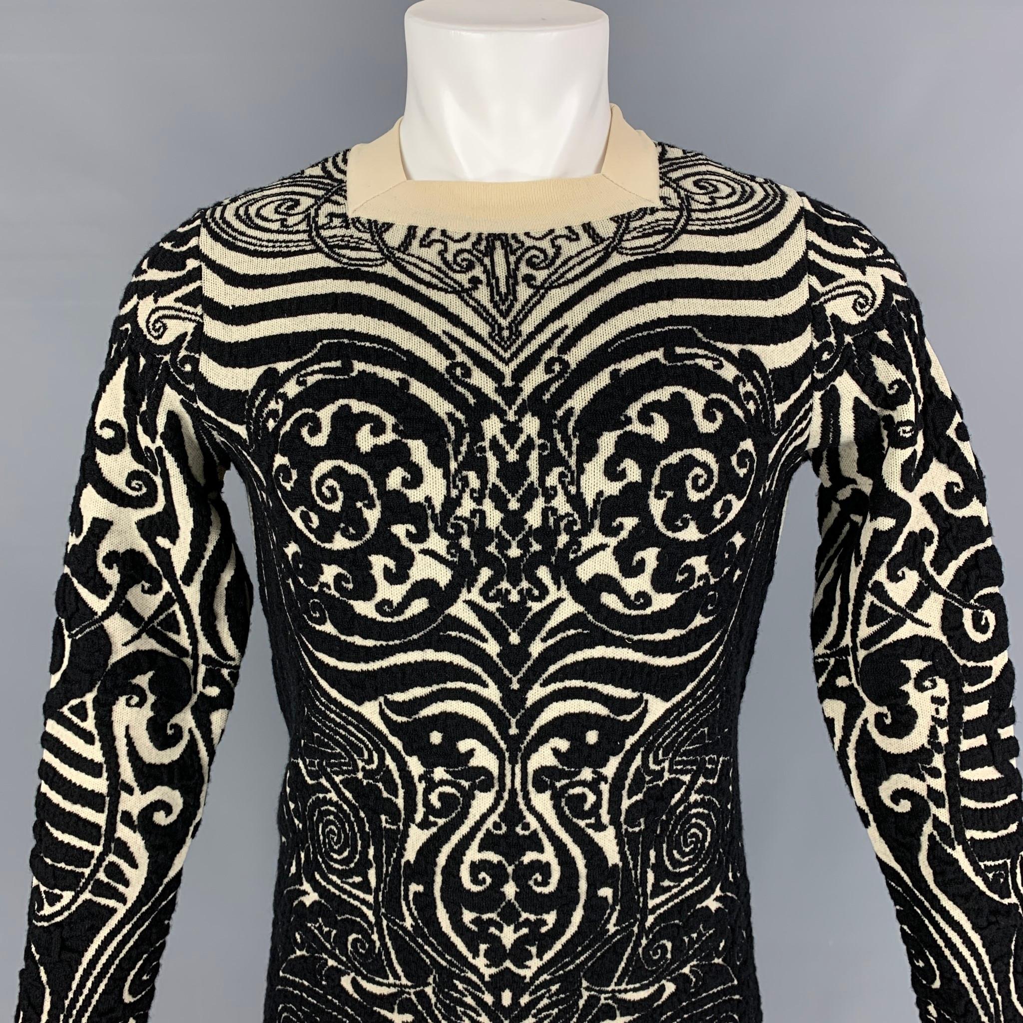 Vintage 1990's JEAN PAUL GAULTIER pullover comes in a black & beige tattoo design wool / polyamide featuring a square neck-line. Made in Italy. 

Very Good Pre-Owned Condition.
Marked: M

Measurements:

Shoulder: 16.5 in.
Chest: 38 in.
Sleeve: 28