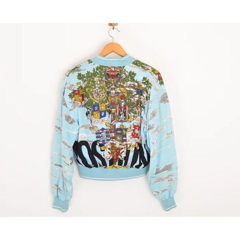 Vintage 1990s Moschino cotton bomber jacket, with large 'Moschino' spell out on both the front and back, in addition to various Moschino iconography amongst a bold patterned print ! 

MADE IN ITALY

Features:
Cropped length
Hip pockets
Central line