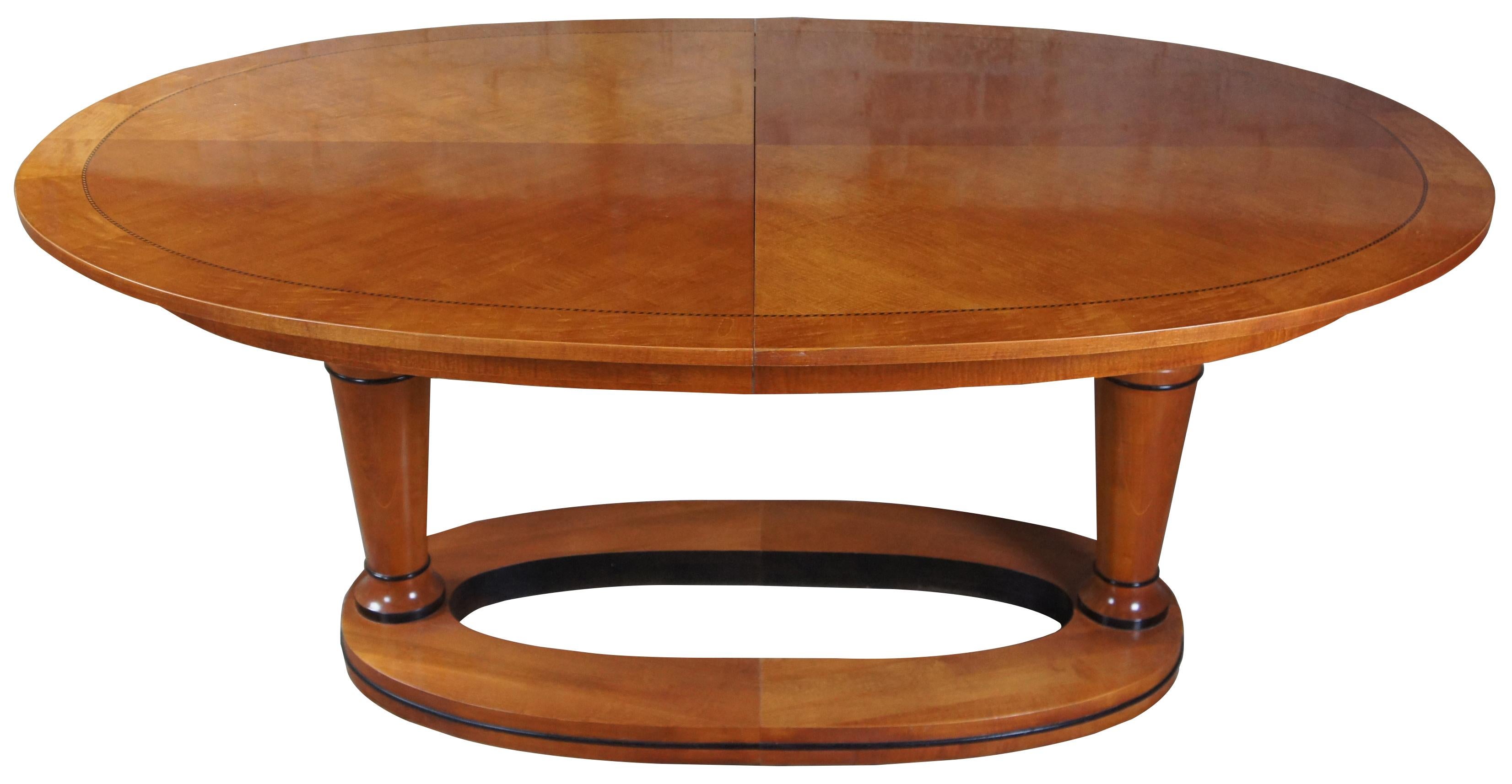 Vintage 1990s Mt. Airy dining table. Made from maple with ebolized accents in an oval shape. Features Biedermeier styling with beautifully turned columns supporting top over base. Extends 18