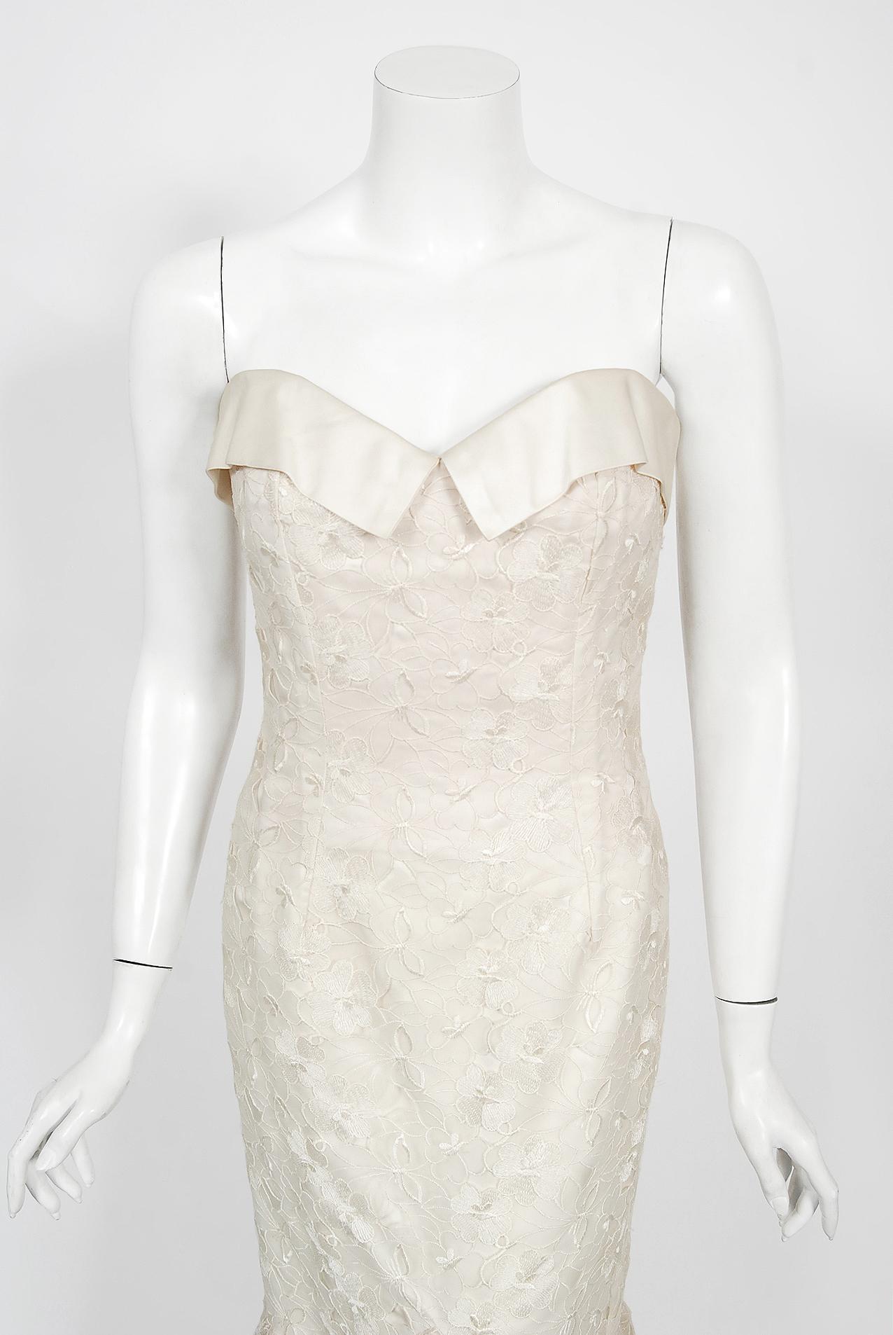 A breathtaking Nolan Miller Couture unworn with tags embroidered silk organza sculpted bridal gown dating back to the early 1990's. Nolan Miller was an acclaimed costume designer best known for his work on the long-running series Dynasty. Miller was