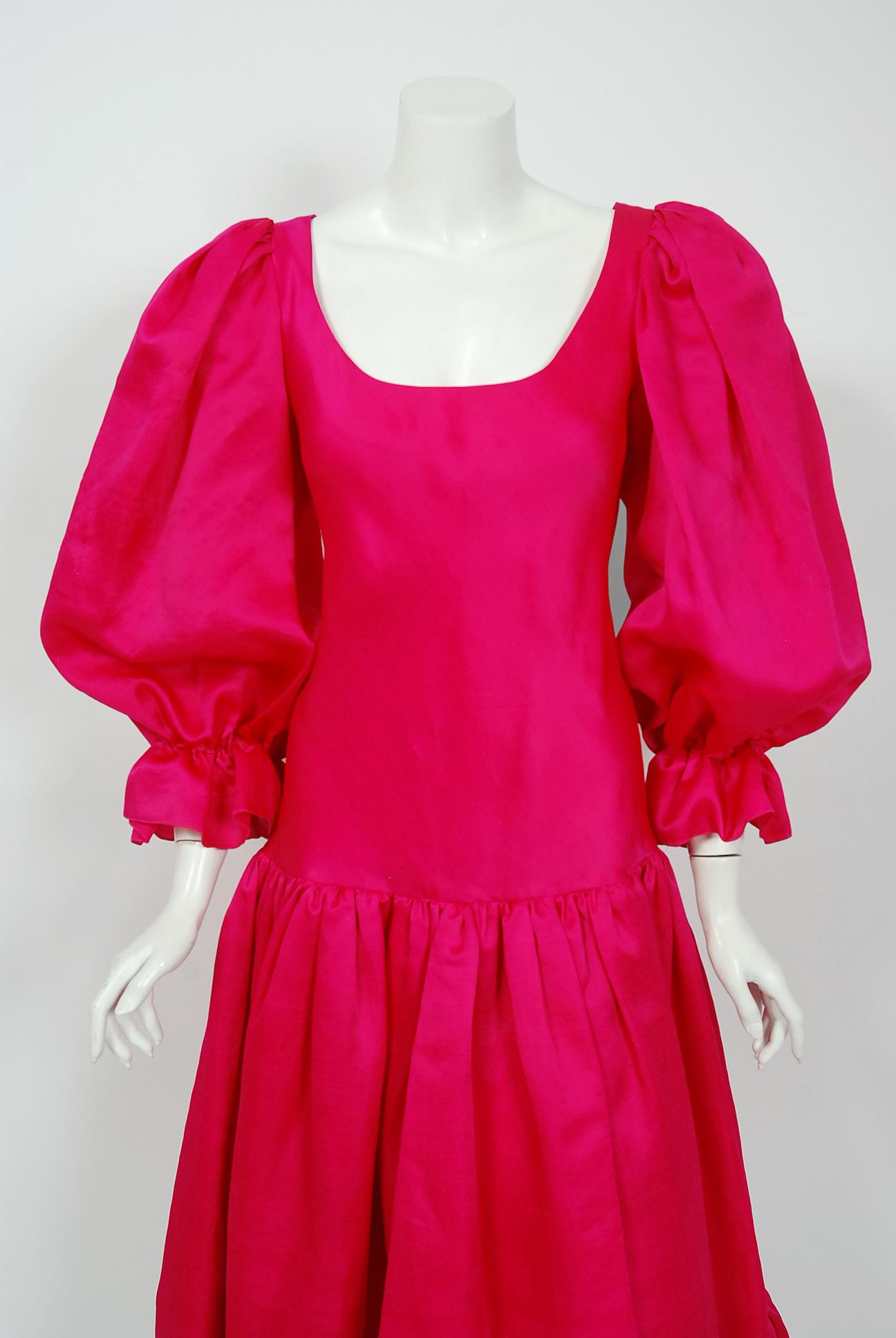 An early 1990's Oscar de la Renta couture shocking pink silk romantic dress which retailed for well over $4,000 when new.  Oscar de la Renta was one of the world's leading fashion designers. Trained by Cristóbal Balenciaga and Antonio Castillo, he