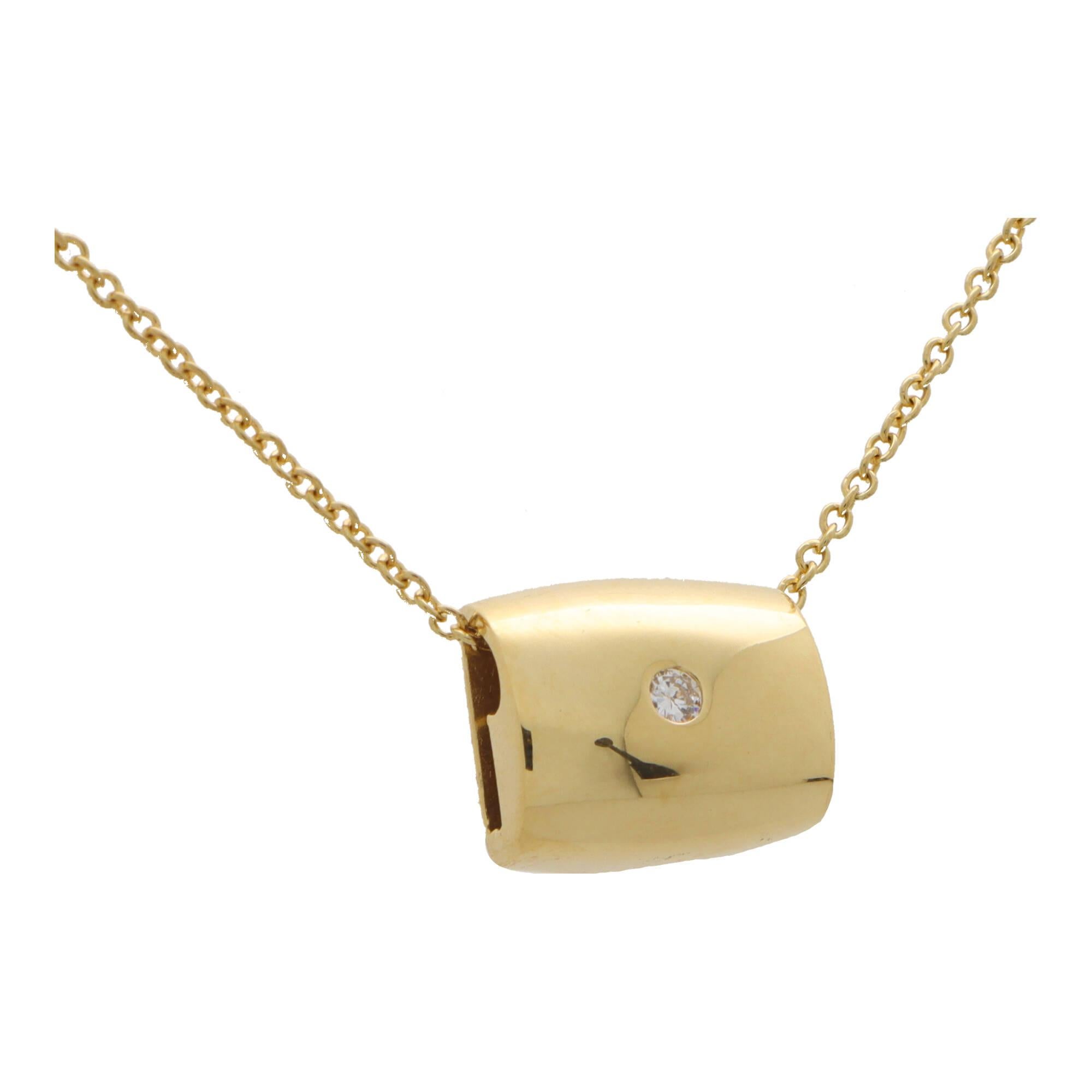 A stylish vintage 1990’s Piaget diamond pendant set in 18k yellow gold.

The pendant is composed of a large heavy weight elongated cushion motif, rub over set to the centre with a round brilliant cut diamond. The pendant is threaded and hangs from