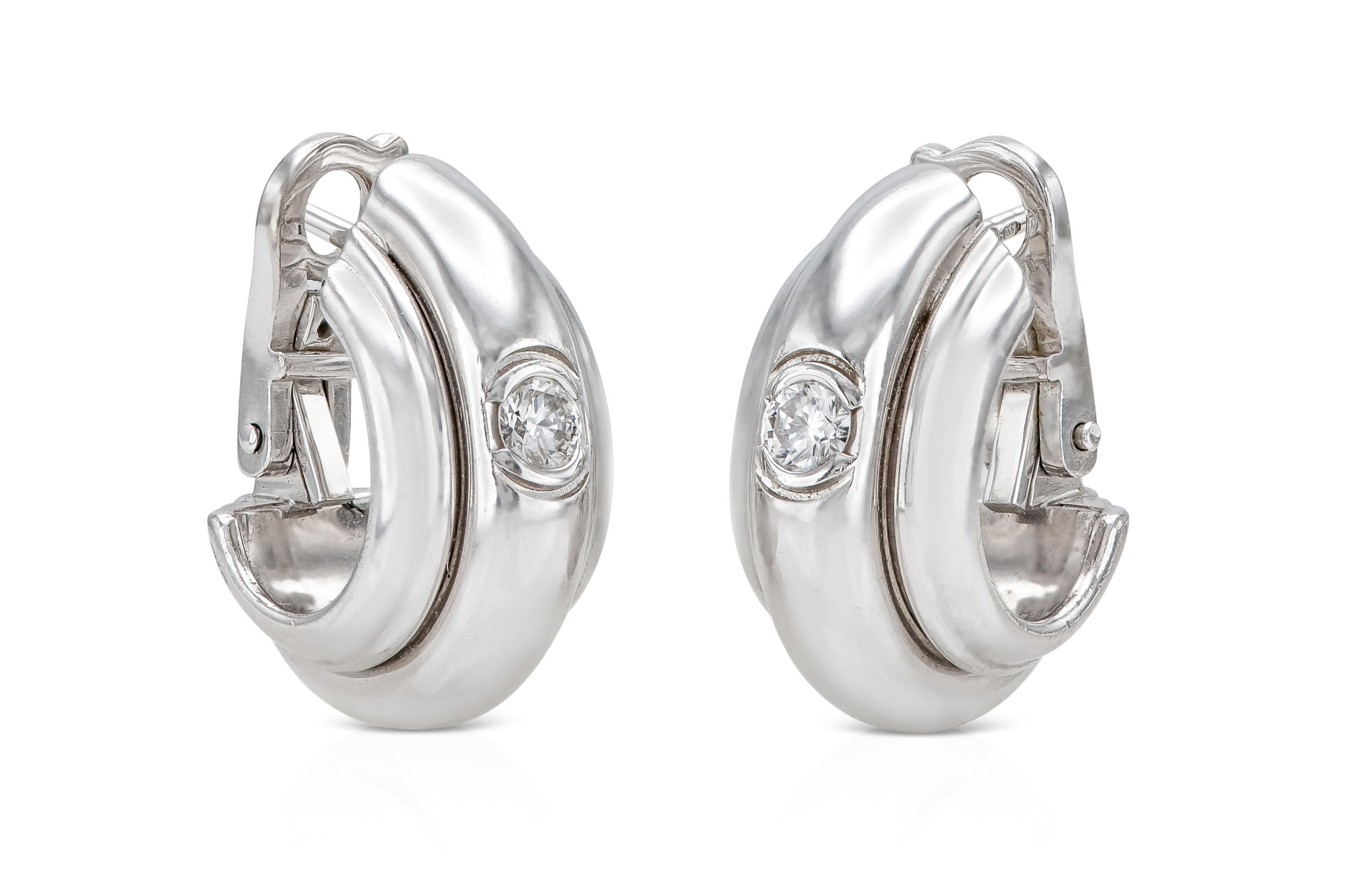 Finely crafted in 18k white gold with a Round Brilliant cut Diamond on both earrings.
Signed by Piaget
Circa 1994
3/4 x 3/8 inch