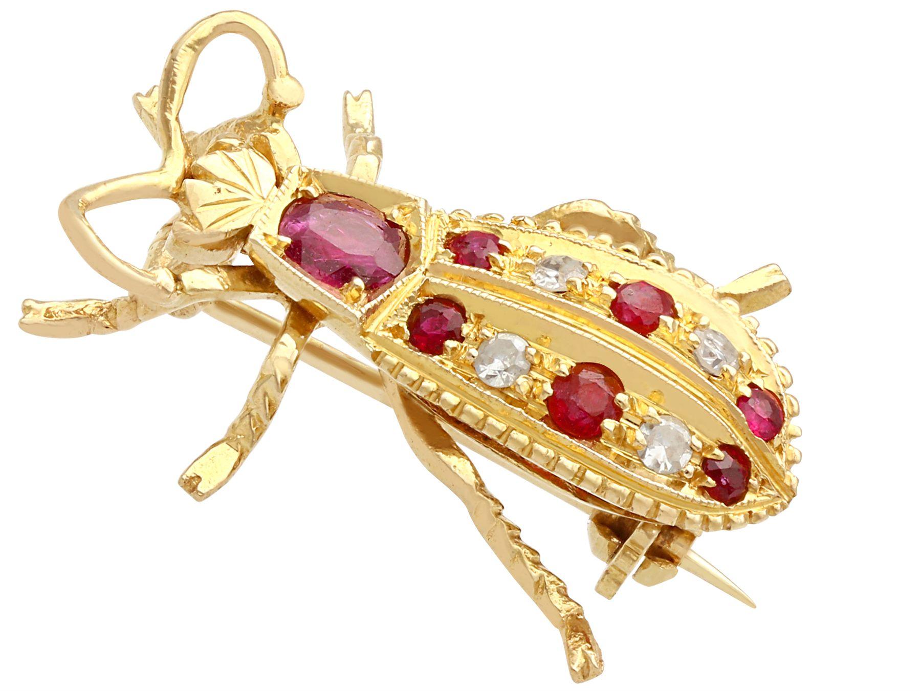 A fine and impressive 0.43 carat ruby and 0.04 carat diamond, 18 karat yellow gold 'insect' brooch; part of our diverse vintage jewelry and estate jewelry collections.

This fine and impressive vintage insect brooch has been crafted in 18k yellow
