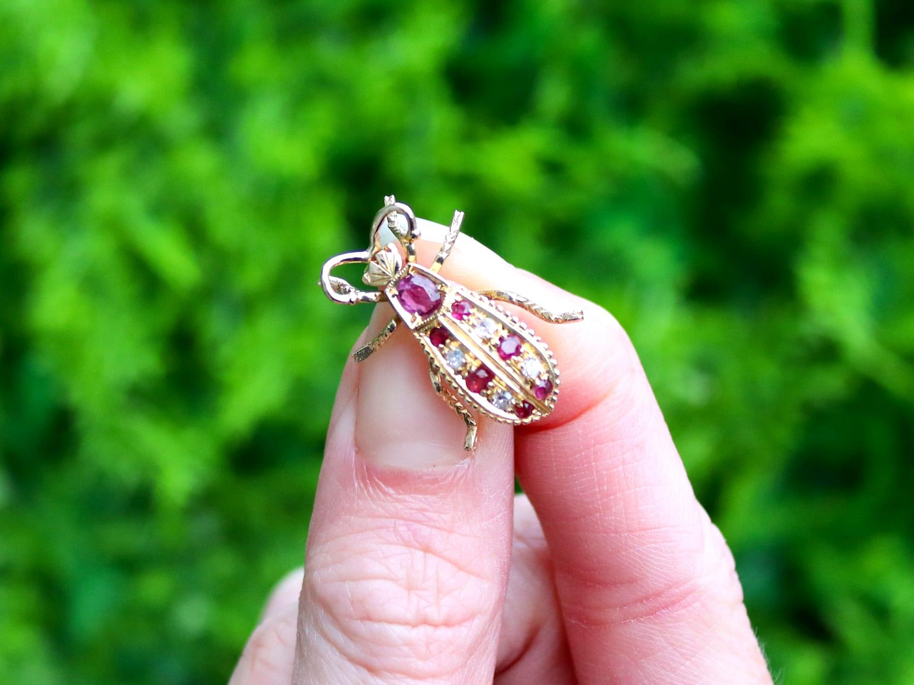 A fine and impressive 0.43 carat ruby and 0.04 carat diamond, 18 karat yellow gold 'insect' brooch; part of our diverse vintage jewelry and estate jewelry collections.

This fine and impressive vintage insect brooch has been crafted in 18k yellow