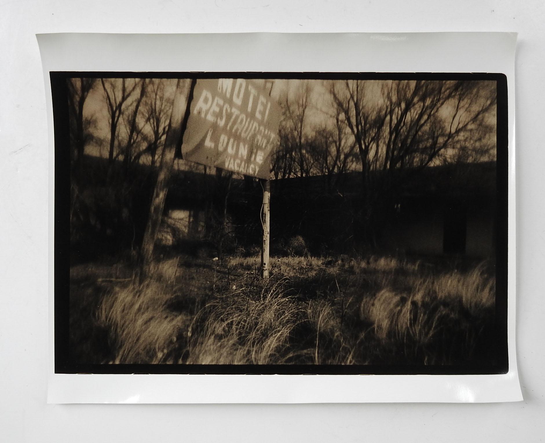 Vintage circa 1990's photograph on heavy paper by Eric C. Weller (20th century) Texas. Dark sepia toned semi glossy photograph of old motel sign. Unsigned, Eric Weller was a professor of photography at Texas State University, from the artists