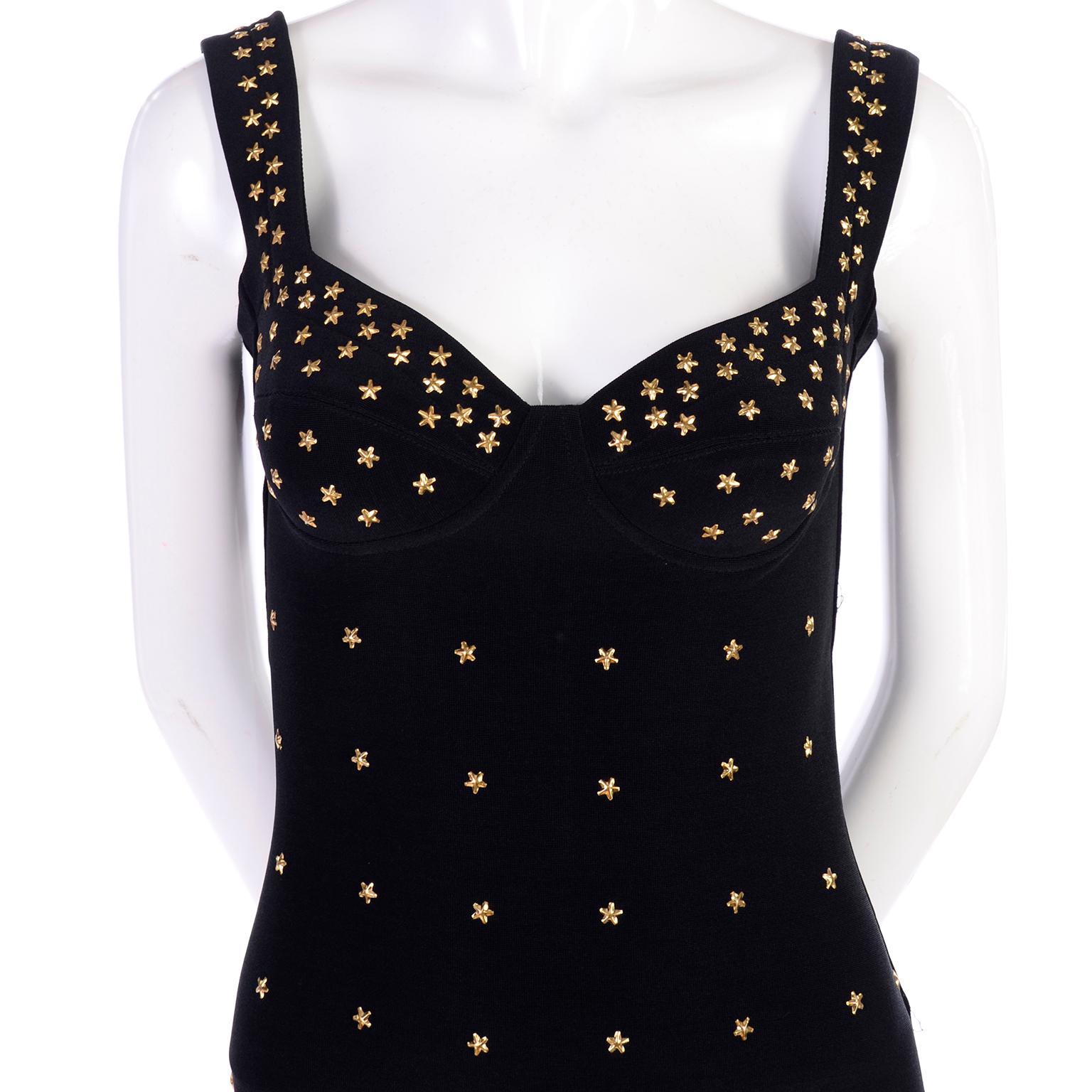 This is a fabulous Tadashi Shoji black stretch bodycon mini dress with gold star studs. The dress is reminiscent of Versace and we love the way the dress is fitted and cut with a low, scoop back. Slips overhead with no closures. We estimate this