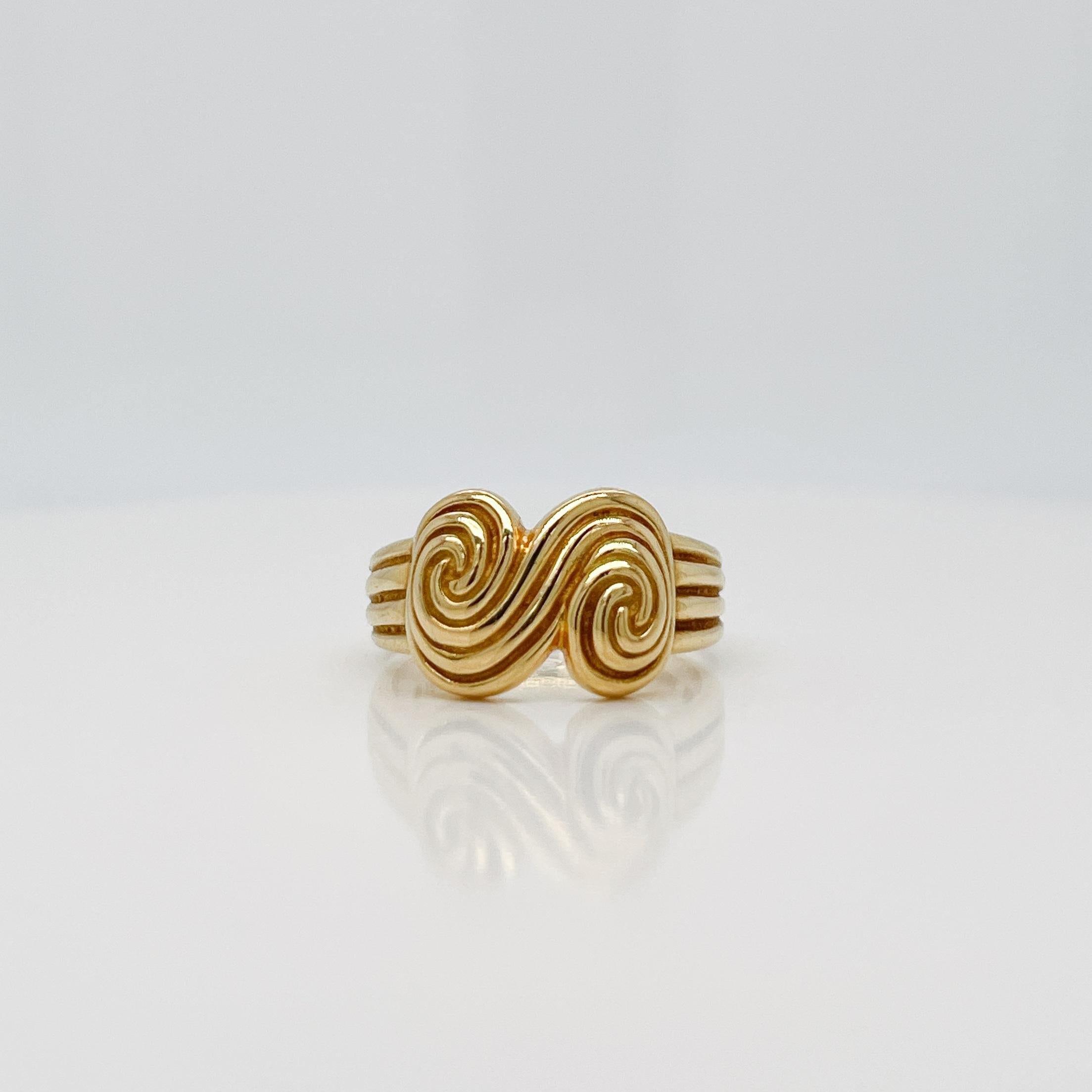 A very fine vintage 'Spiro Swirl' ring.

By Tiffany & Co.

In 18k yellow gold.

Simply a great modern form!

Date:
1990s

Overall Condition:
It is in overall good, as-pictured, used estate condition with some fine & light surface scratches and other