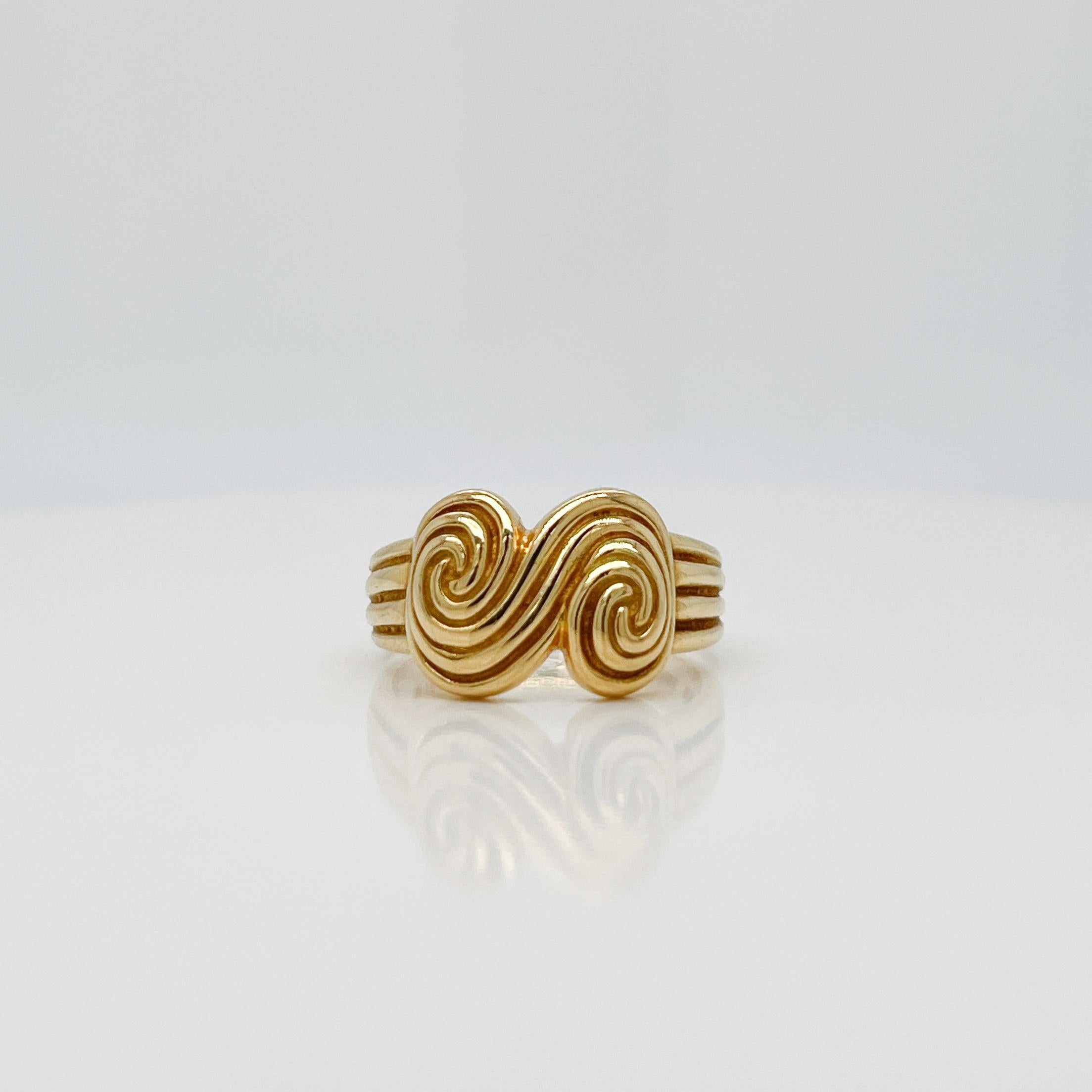 A very fine vintage 'Spiro Swirl' ring.

By Tiffany & Co.

In 18k yellow gold.

Simply a great modern form!

Date:
1990s

Overall Condition:
It is in overall good, as-pictured, used estate condition with some fine & light surface scratches and other