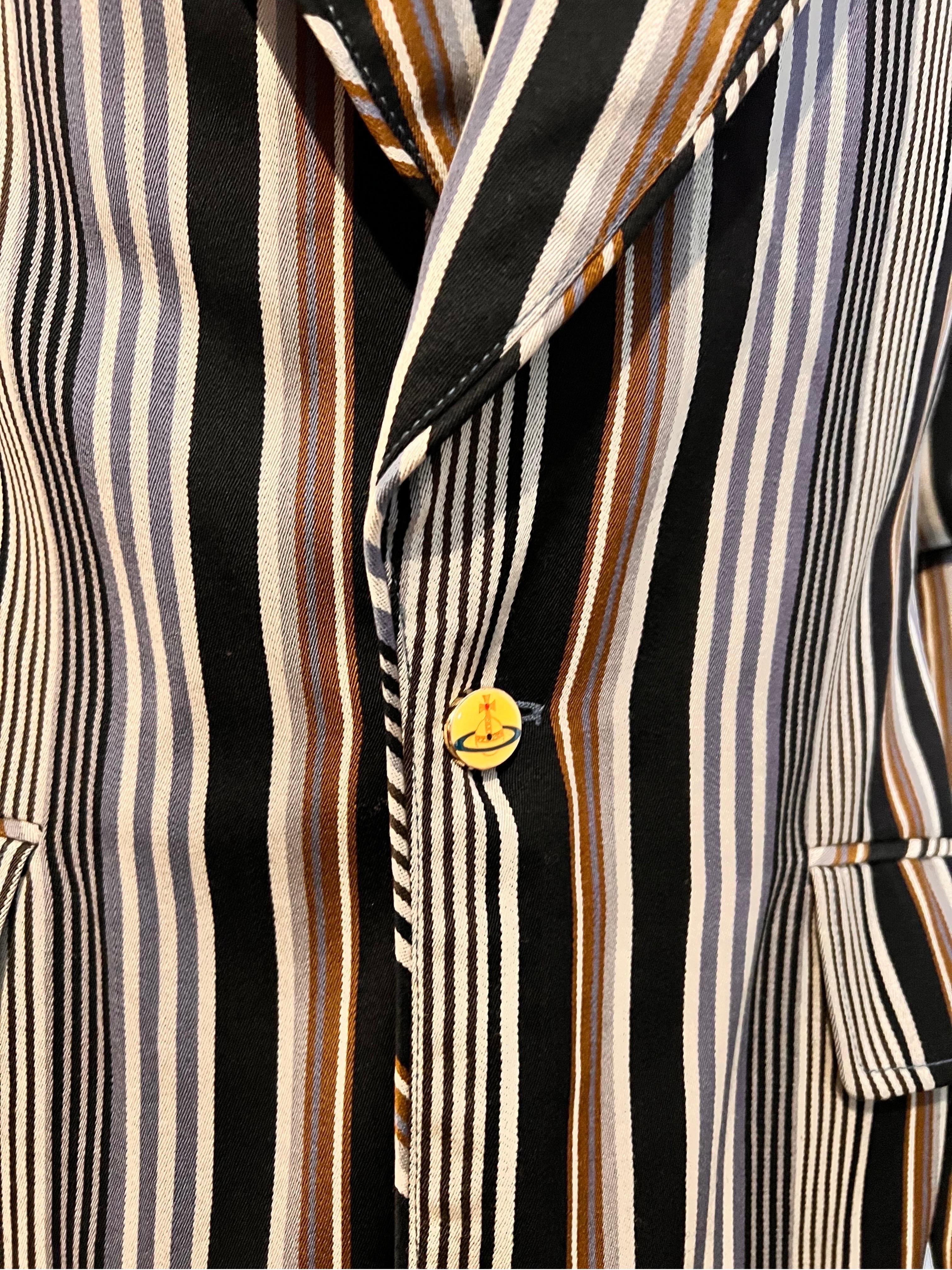 VINTAGE VIVIENNE WESTWOOD Man of London blazer/jacket in wide multi stripe with beautiful piping detail to collar and lapel. 

From the late 1990's era

A special piece of vintage Westwood with unique button detail, cuff link style buttons in the