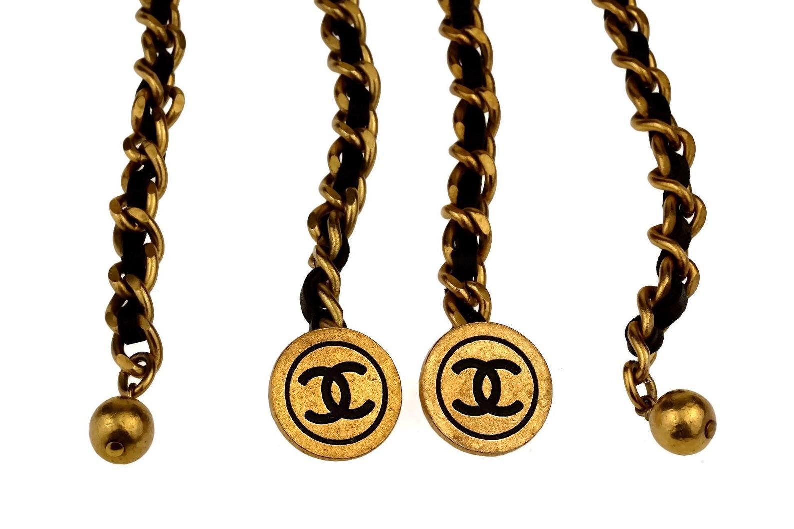 Vintage 1993 CHANEL Leather Chain CC Medallion Cufflinks Bracelet

Measurements:
Length: 12.20 inches (31 cm)
Medallions: 0.78 inch (2 cm)

Features:
- 100% Authentic CHANEL.
- Medallions with CC logos.
- Iconic CHANEL leather and chain cufflinks/