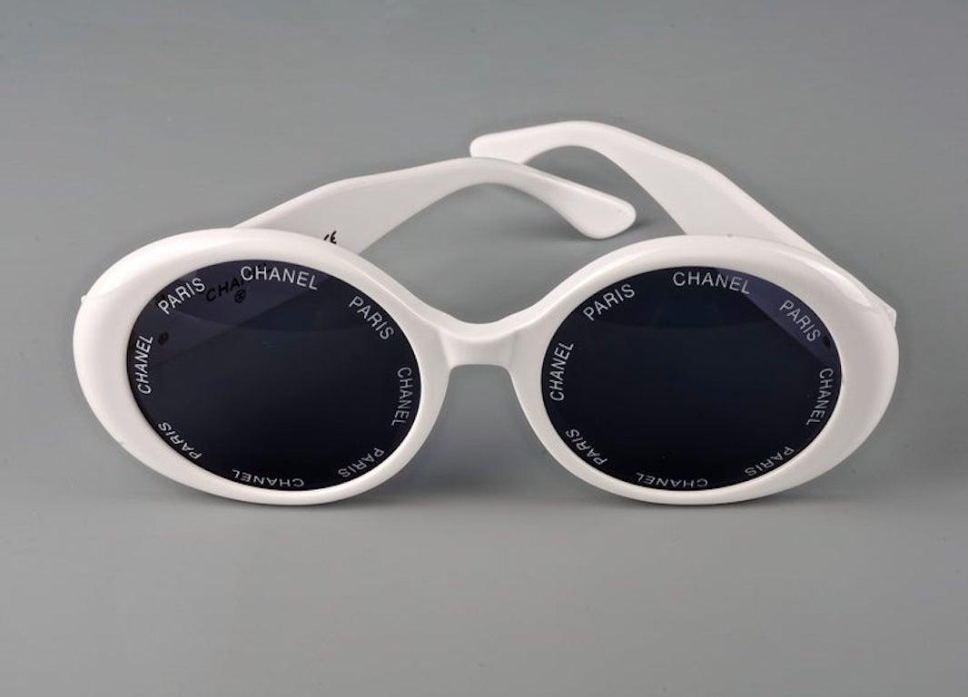 Vintage 1993 Iconic CHANEL PARIS Lens Round White Sunglasses As Seen On Rihana

Measurements:
Height: 2.36 inches (6 cm)
Frame Width: 5.70 inches (14.5 cm)
Arm: 5.23 inches (13.3 cm)

As seen on Rihanna.
From CHANEL Spring/ Summer 1993