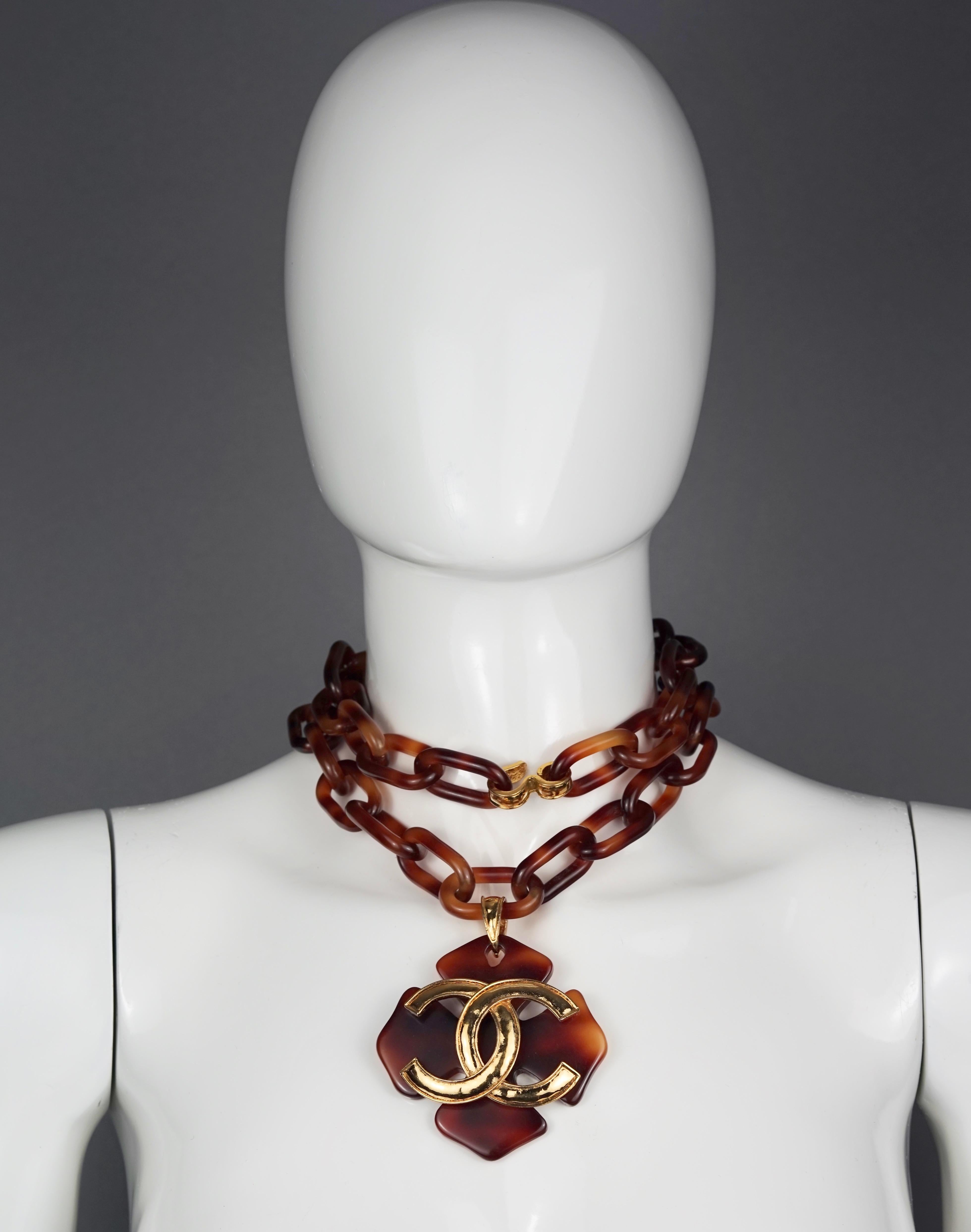 Vintage 1994 CHANEL Jumbo Logo Maltese Cross Tortoiseshell Necklace

Measurements:
Pendant Height: 3.15 inches (8 cm)
Chain Height: 0.78 inch (2 cm)
Wearable Length: 33.07 inches (84 cm) adjustable

Features:
- 100% Authentic CHANEL.
- Lucite faux