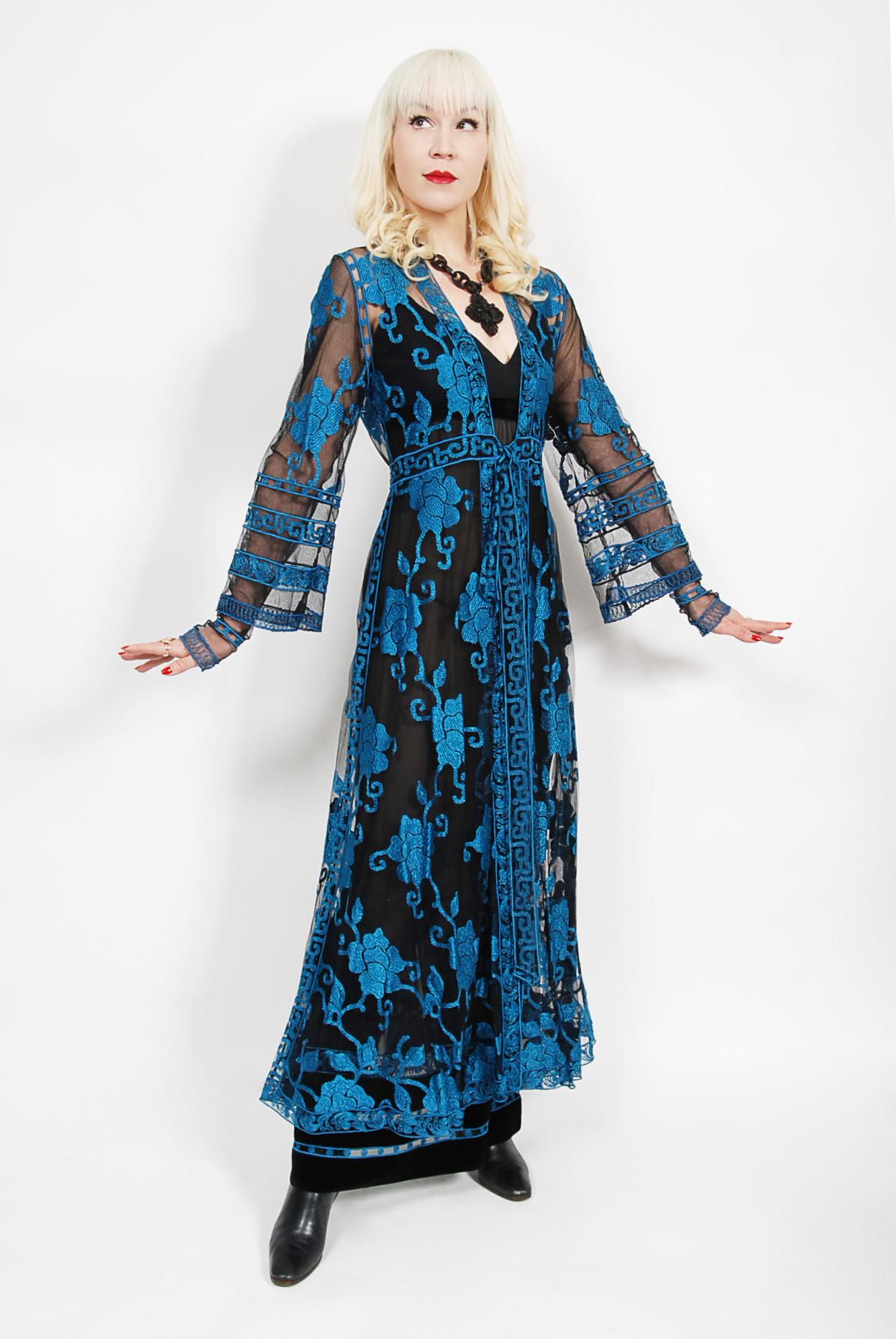 This magnificent and highly coveted 1994 Chloe fall-winter collection runway embroidered blue roses sheer-net gown ensemble is a perfect example of why Karl Lagerfeld's talent has stood the test of time. Karl Lagerfeld sadly passed away in 2019,