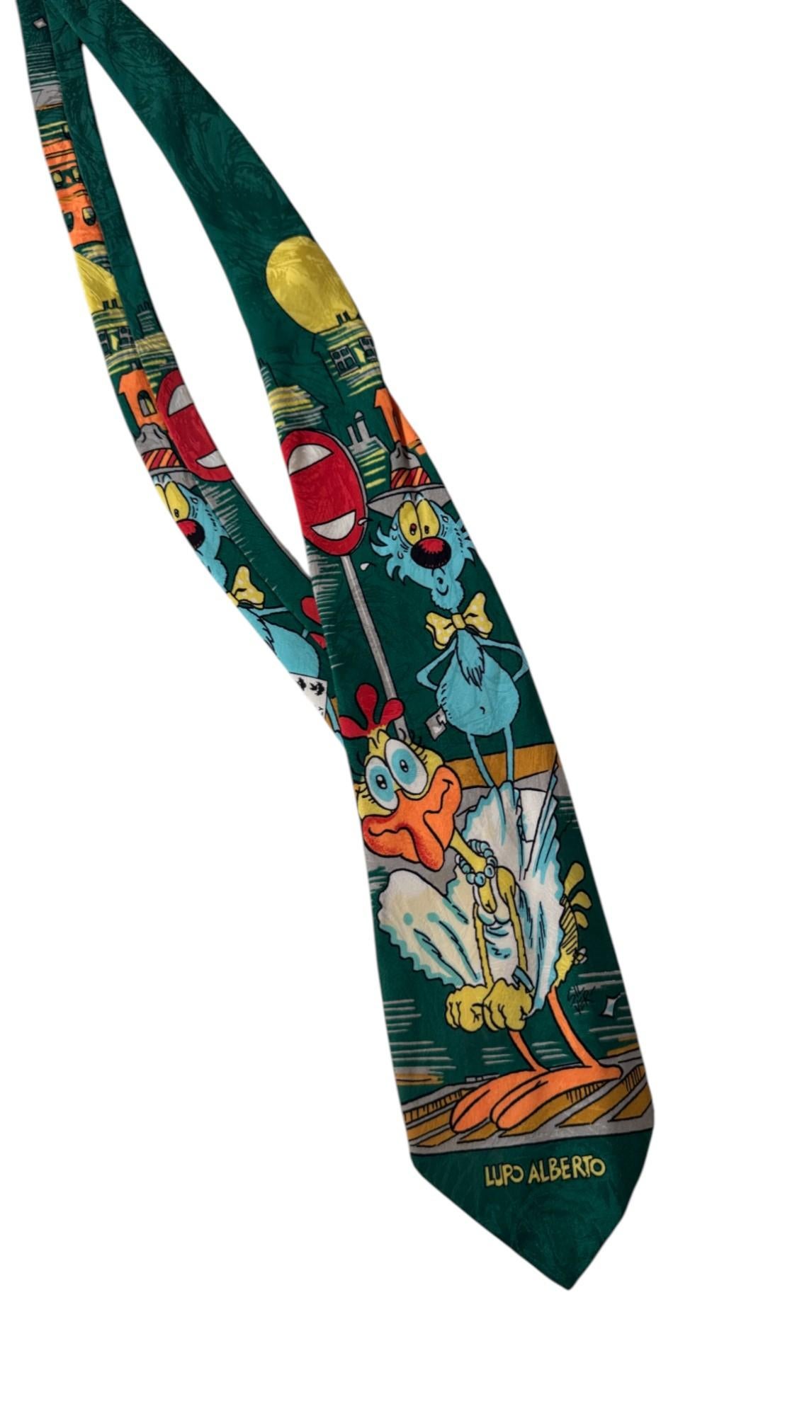 Step into the vibrant world of 1990s Italian pop culture with this rare 1994 Lupo Alberto silk tie, designed by Silver (Guido Silvestri) and produced in Italy by Caritus® / Carpe Diem S.r.l. The bold, playful print features the iconic blue wolf Lupo