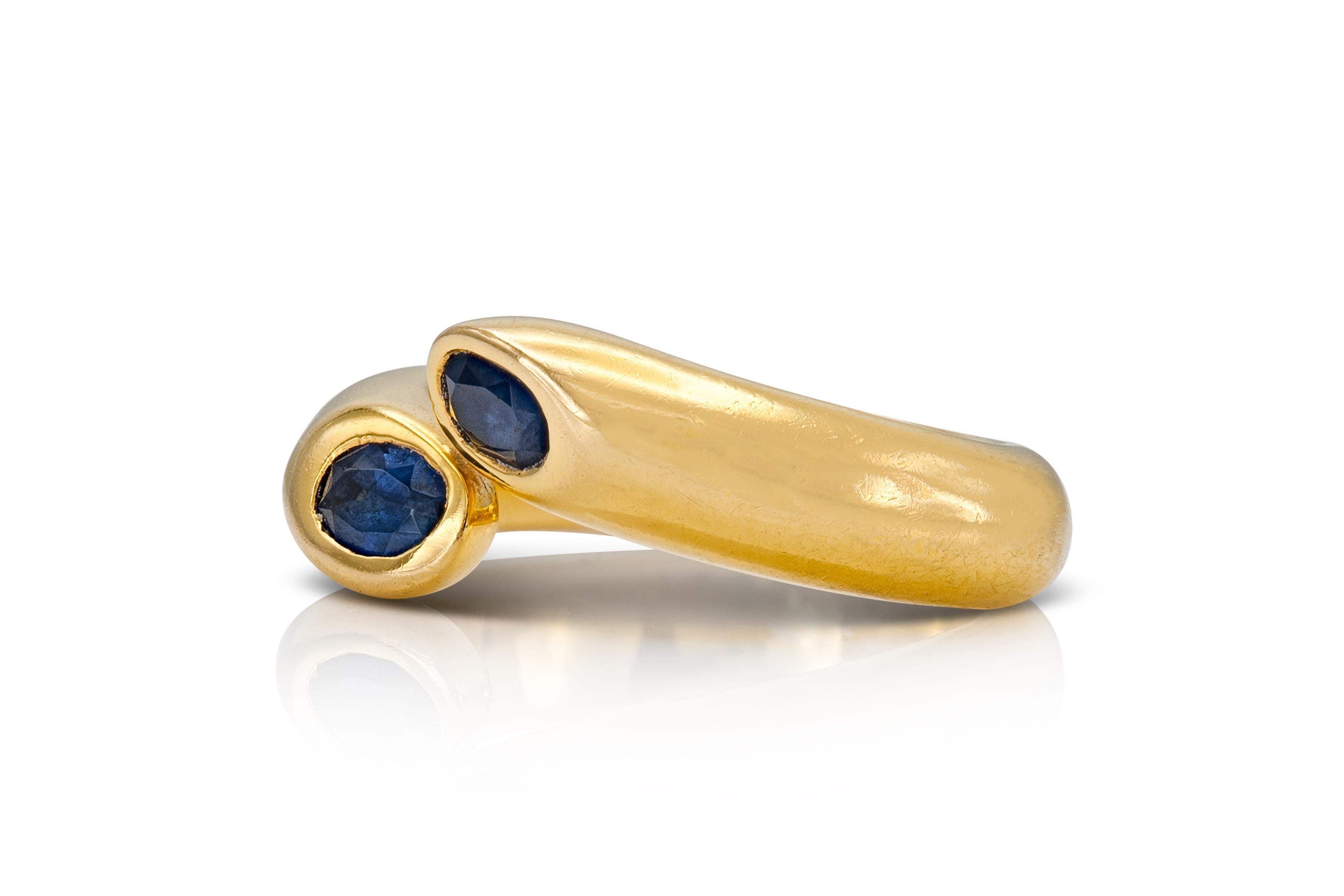 Finely crafted in 18k yellow gold with two Oval cut Sapphires.
Signed by Cartier
Circa 1995
Size 47 (US 4 1/4)