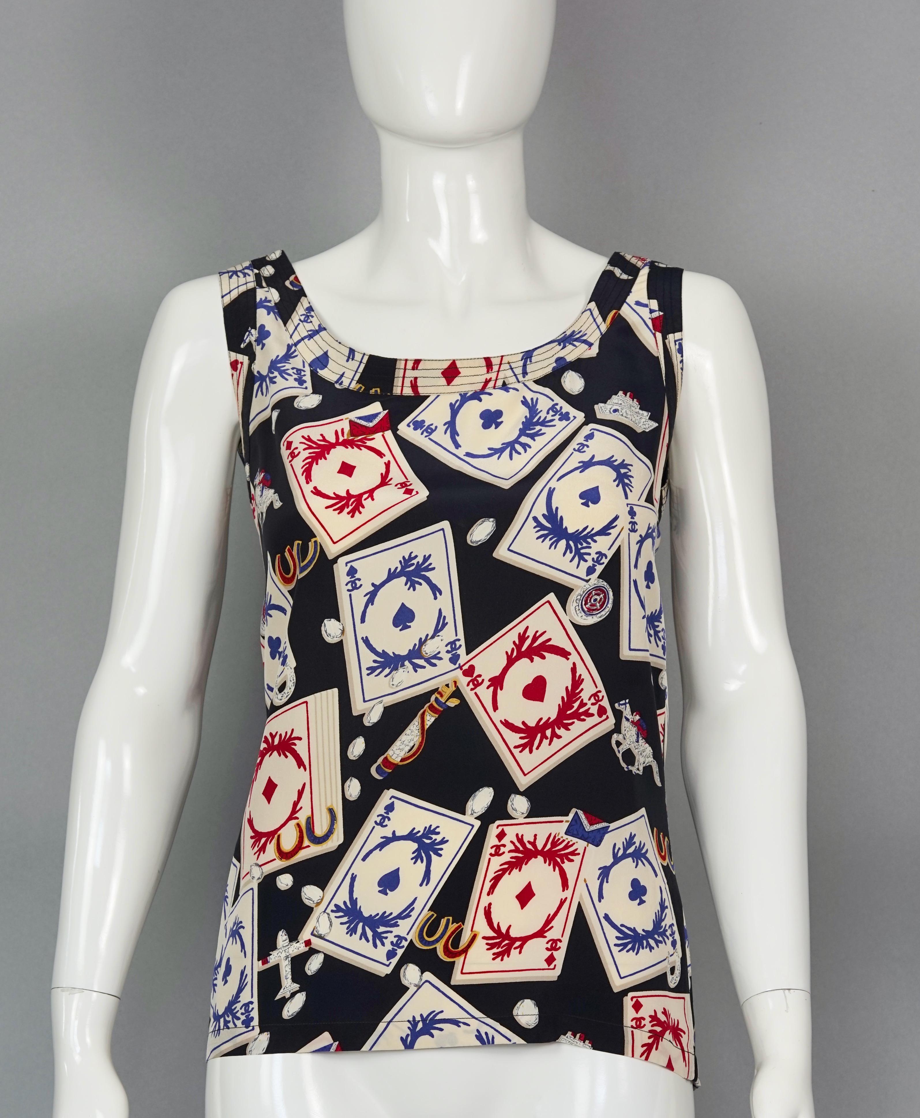 Vintage 1995 CHANEL Playing Cards Print CC Logo Button Silk Top

Measurements taken laid flat, please double bust, waist and hips:
Shoulder: 14.56 inches (37 cm)
Bust: 16.92 inches (43 cm)
Waist: 16.53 inches (42 cm)
Length: 23.62 inches (60