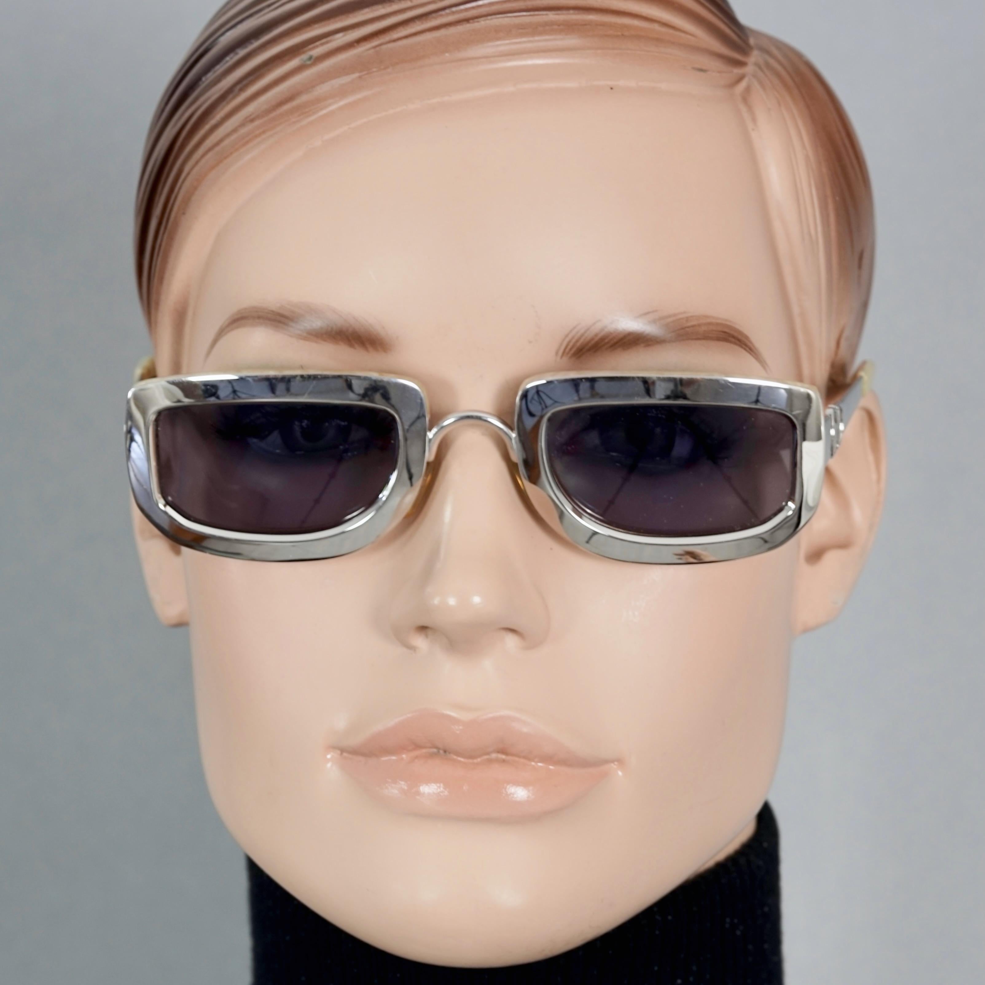 Vintage 1995 CHRISTIAN DIOR Silver Chrome Futuristic Sunglasses

Measurements:
Height: 1.53 inches (3.9 cm)
Horizontal Width: 5.12 inches (13 cm)
Temples: 5.31 inches (13.5 cm)

Features:
- 100% Authentic Vintage CHRISTIAN DIOR. 
- Rectangular